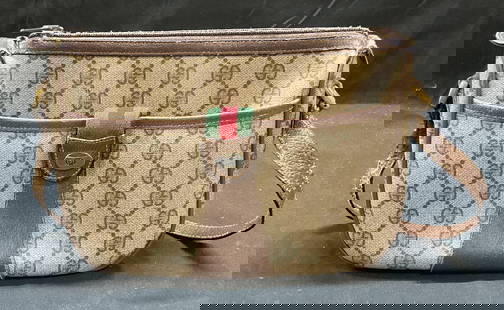 Vintage Gucci Monogram Canvas Handbag Italy: Vintage Gucci Accessory Collection monogram canvas handbag with leather trim. Signed on interior. Made in Italy. Serial number 89 02 032. Measures approx 6 x 9 x 3.5 inches. Wear to materials consiste