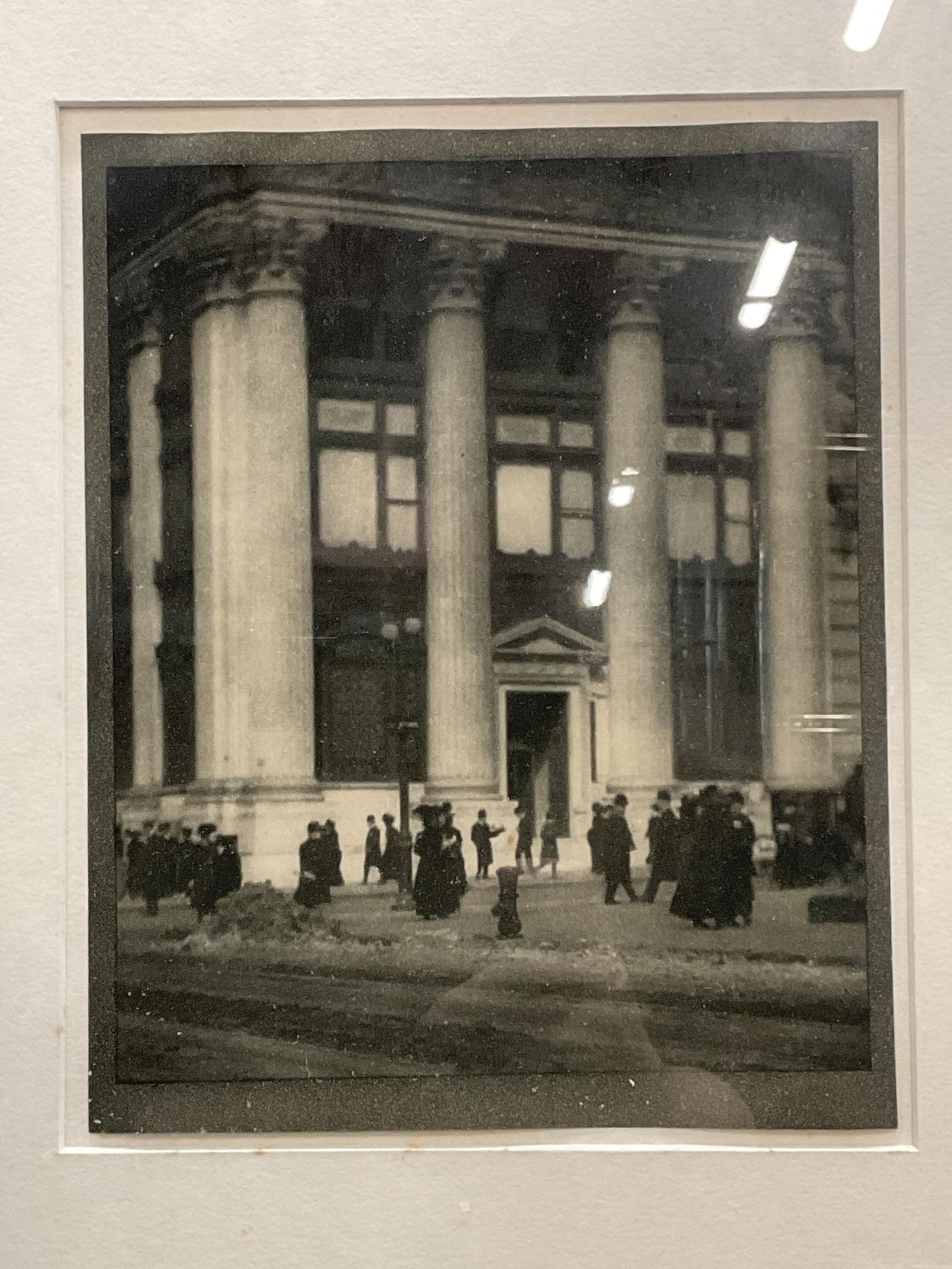 Attr Coburn Knickerbocker Trust Photogravure: Framed and matted print. Attributed to Alvin Langdon Coburn. The Knickerbocker Trust. Exterior of building with figures. Appears to be photogravure on gray paper. Print date unknown. Gold tone metal f