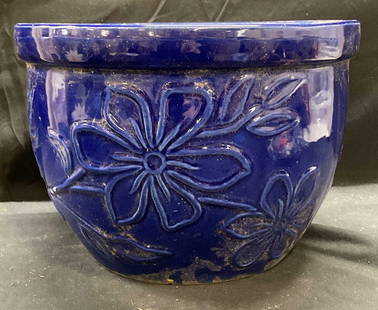 Cobalt Blue Ceramic Floral Planter: Cobalt blue glazed ceramic planter with raised floral motif. Measures approx 11.5 x 8.5 inches. Some scratching and residue. Some small chips. Planter, ceramic planter, homewares, home decor, home acc