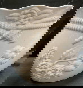 Andrea by SADEK White Ceramic Planter: Andrea by SADEK white ceramic planter with raised floral design. Signed on underside. Measures approx 12.5 x 11.25 inches. Scratching, hairline cracks, chips, and residue. Planter, ceramic planter, ho