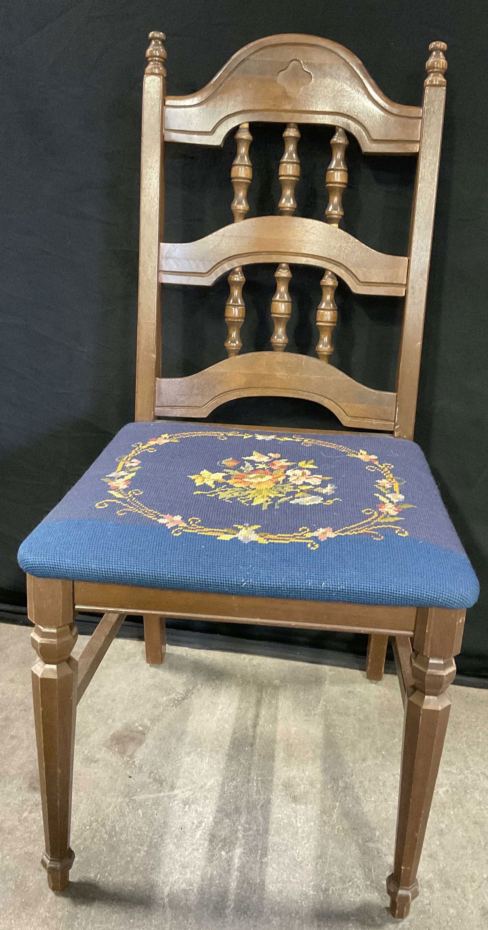 AUTHENTIC FURNITURE PRODUCTS Needlepoint Chair: AUTHENTIC FURNITURE PRODUCTS Needlepoint Chair. Underside reads AUTHENTIC FURNITURE PRODUCTS. Carved wood frame with a floral needlepoint seat. Multicolored hues to the seat. Chair measures approx. 36
