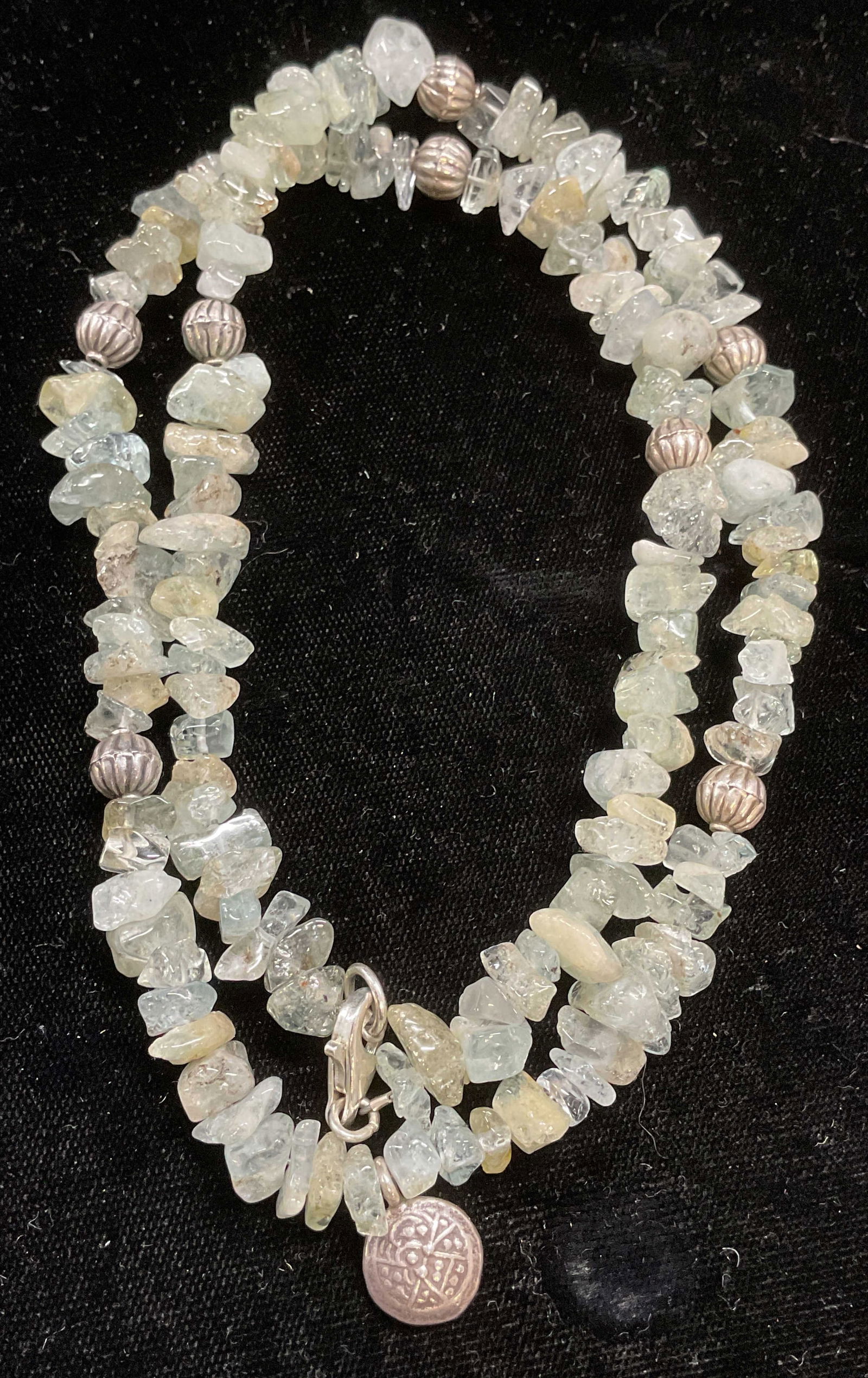 Semiprecious & Sterling Silver Beaded Necklace: Blue semiprecious stone and sterling silver accented beaded necklace. Marked sterling on clasp. Drop length approx 11 inches. Total weight 47.2 grams. Some wear including scratching. Jewelry, estate j