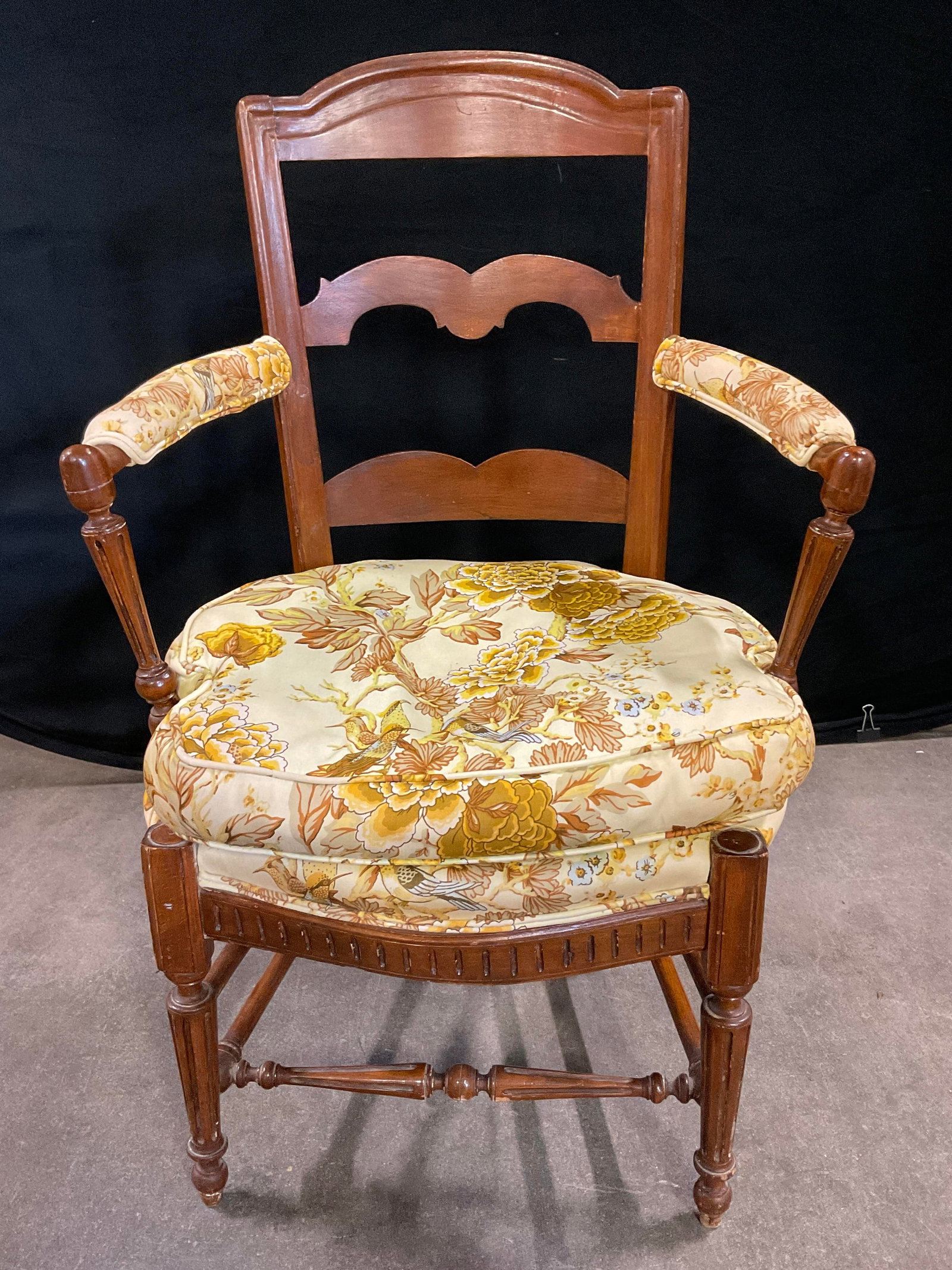 Vintage Carved Wood Cushioned Seat Armchair: Vintage Carved Wood Cushioned Seat Armchair. Ladder back. Stretcher to the legs. Removable cushion to the upholstered seat. Soft hand upholstery to the cushions. Bird, floral, and foliage motif to the