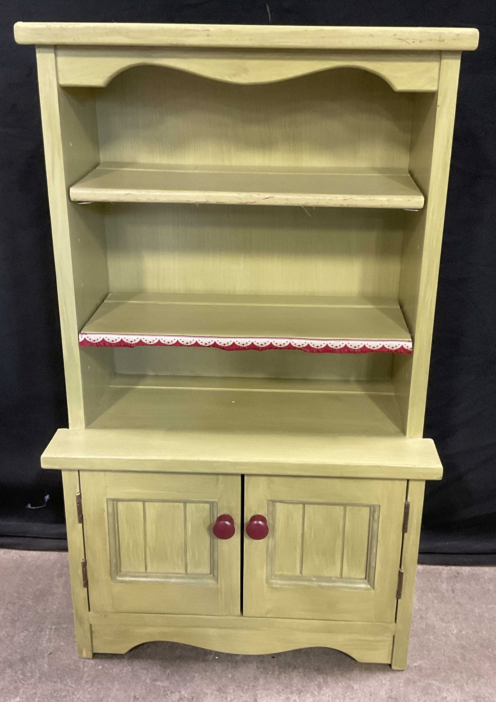 Vintage Childrens Wooden Hutch Toy / Display: Vintage Childrens Wooden Hutch Toy / Display / Storage. Painted in primarily green hues. Some fabric accents. Two doors to obverse open to reveal more storage. Measures approx. 29H x 17W x 9D in. Loss