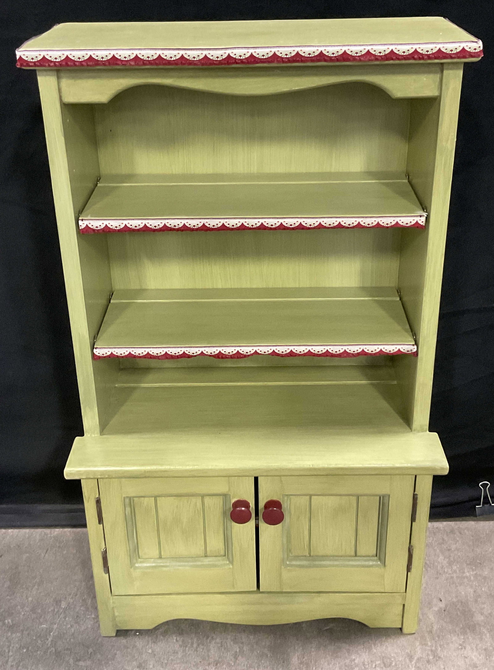 Vintage Childrens Wooden Hutch Toy / Display: Vintage Childrens Wooden Hutch Toy / Display / Storage. Painted in primarily green hues. Some fabric accents. Two doors to obverse open to reveal more storage. Measures approx. 29H x 17W x 9D in. Chip