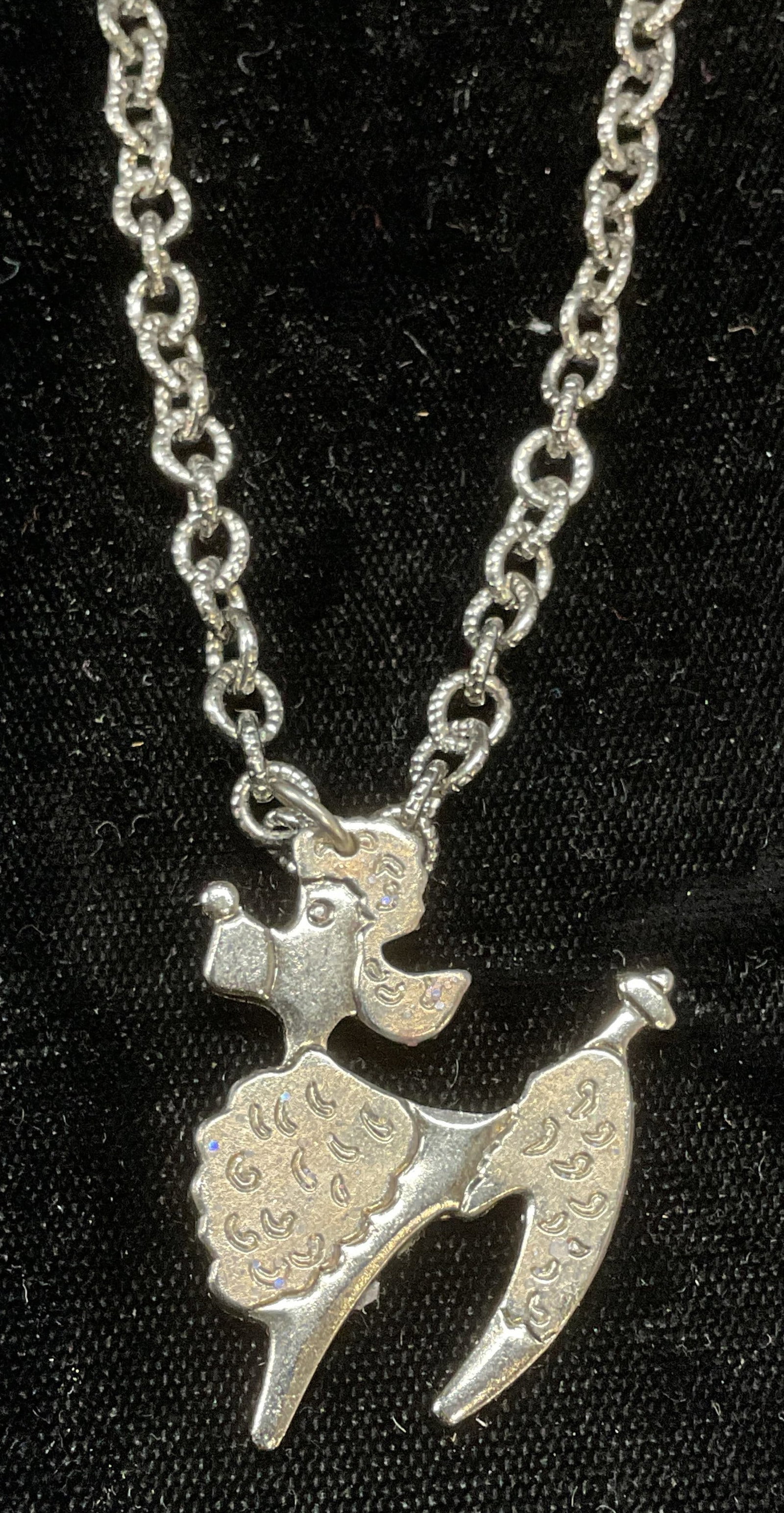 Silver Tone Poodle Pendant Necklace: Silver tone necklace with poodle motif pendant. Drop length approx 7.5 inches. Some wear including scratching. Jewelry, estate jewelry, costume jewelry, cocktail jewelry, fashion jewelry, accessories,