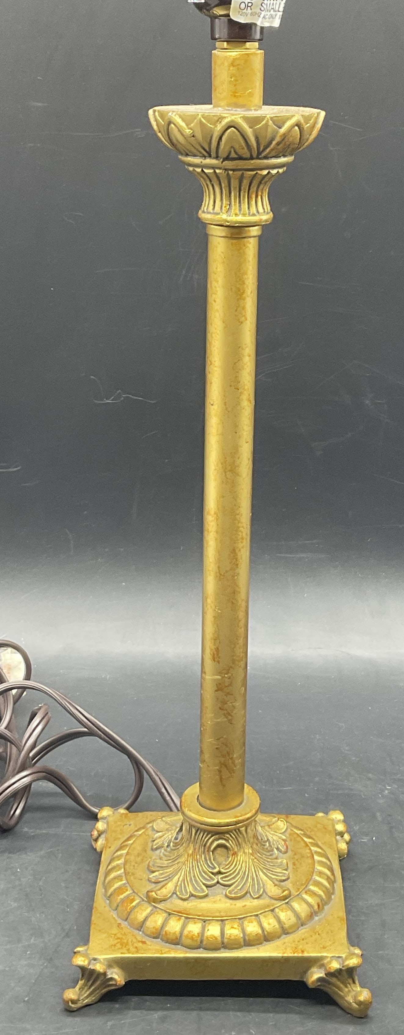 NANTUCKET Gilt Metal Table Lamp: NANTUCKET Gilt Metal Table Lamp. Sticker to underside reads NANTUCKET. Corded. Not tested for function. Measures approx. 17.25H x 4.5W in. Surface wear and discoloration present. Lighting, lighted fix