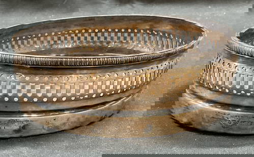 Vintage GORHAM Silver Plated Bottle Coaster: Vintage GORHAM silver plated bottle coaster. Silver plate with wood. Signed. Pierced rim with raised detail. Measures approx 5.75 x 2 inches, patina and some warping observed. GORHAM, GORHAM bottle co
