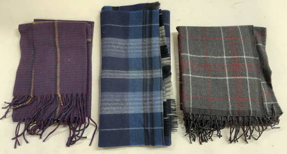 Lot 3 Plaid Woven Wool Scarves, Ermenegildo Zegna+: Lot includes 3 scarves. Each appear to be wool, possibly wool blend. Includes blue, dark slate (tag reads ERMENEGILDO ZEGNA, & purple toned plaid scarves. Each scarf has fringes. Largest scarf measure