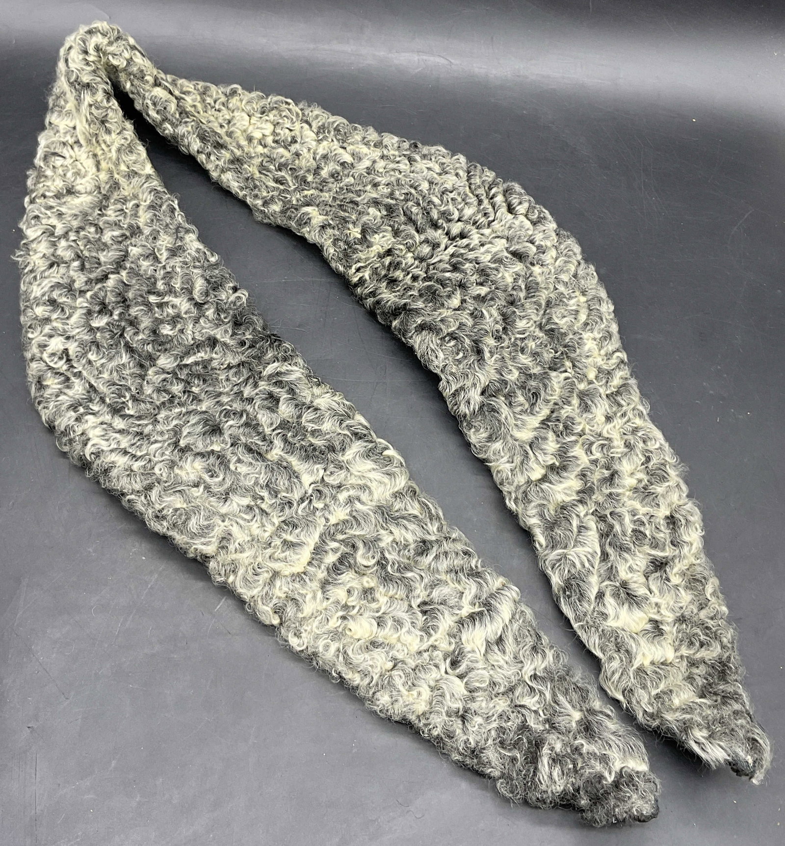 Vintage Lambswool Collar / Accessory: Vintage Lambswool Collar / Accessory. Black, gray, and white hues throughout. Black fabric backing to the lambswool. Measures approx. 42W x 5L in. Losses, discoloration, and surface wear present. Wear