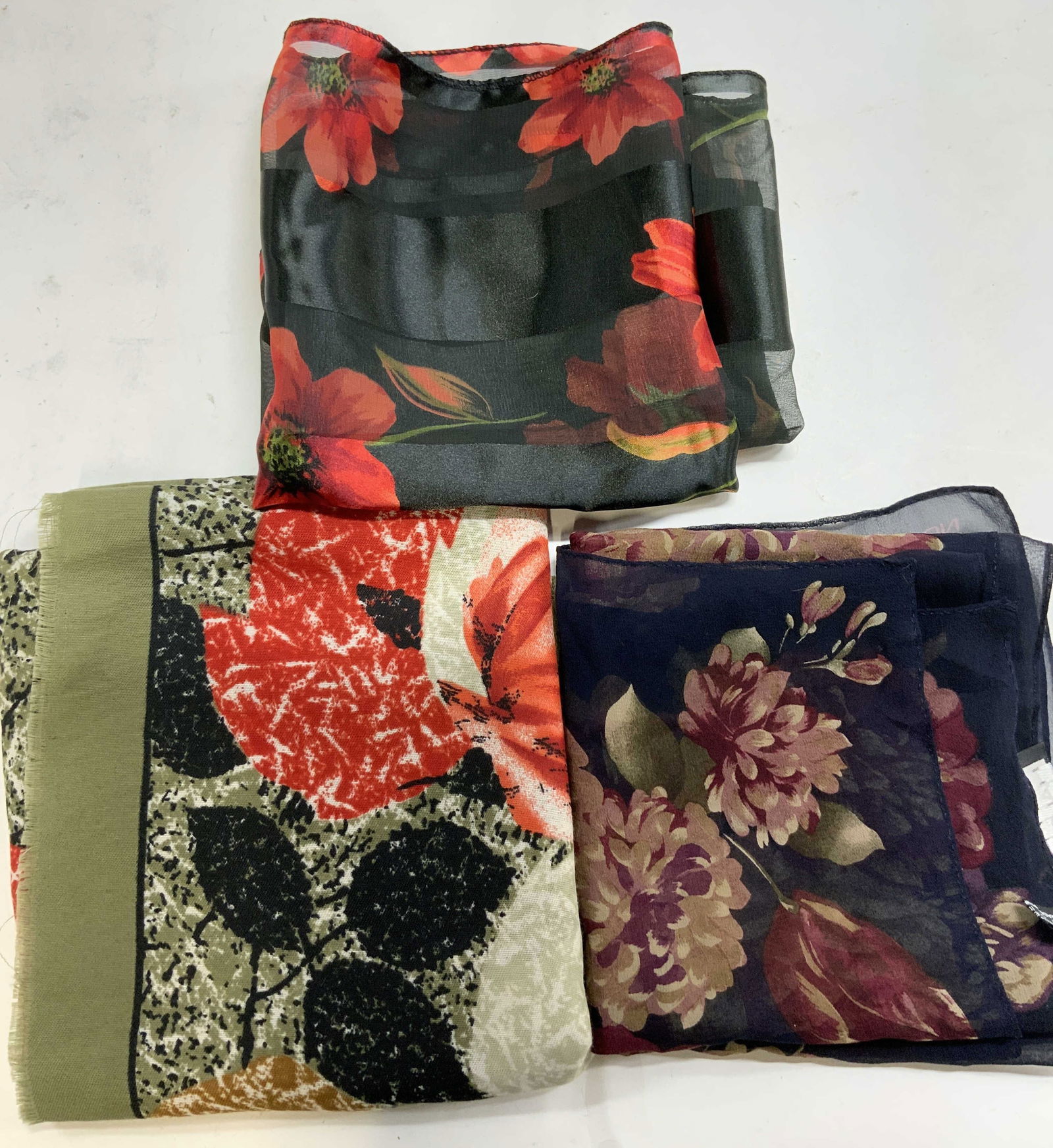 3 Scarves HALSTON Floral Silk KOREA & More: 3 HALSTON Floral Silk Scarves KOREA One scarf reads HALSTON, 100% SILK. One scarf reads Silk Feel. Made in KOREA. Signed & marked. Surface wear consistent to age, use & exposure. Measurements: length