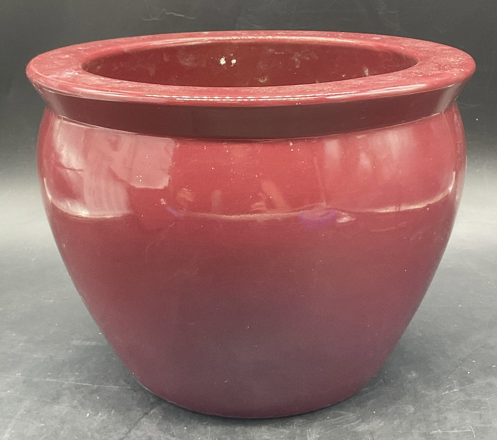 MID ATLANTIC POTTERY Handmade Burgundy Planter: MID ATLANTIC POTTERY Handmade Burgundy Planter. Sticker to the underside reads HANDCRAFTED FOR MID ATLANTIC POTTERY. Measures approx.8.5W x 6.25H in. Thick walled and weighty. Discoloration, residue, 