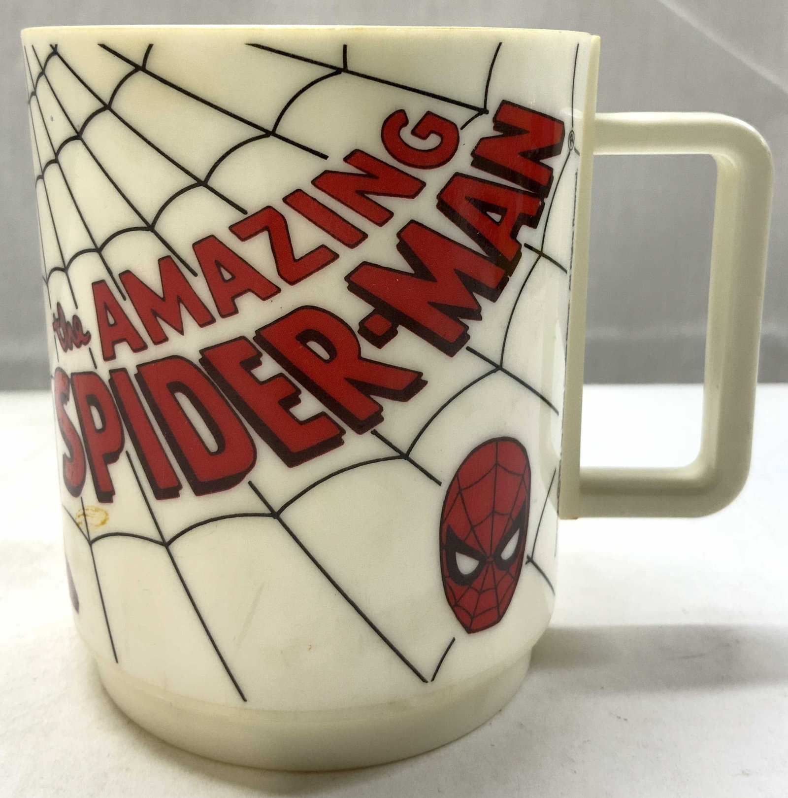 Vintage MARVEL The Amazing Spiderman Mug 1977: MARVEL The Amazing Spiderman Mug 1977 Mug features an illustration of Spider-man & words. Signed & marked. Surface wear consistent to age, use & exposure. Measurements: length 3in x width 3in x height