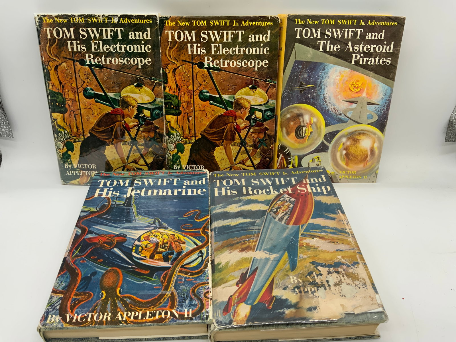 5 TOM SWIFT Adventure Books 1950s VICTOR APPLETON: 5 TOM SWIFT Adventure Books 1950s VICTOR APPLETON 5 adventure hardcover books including, 2 TOM SWIFT & His Electronic Retroscope, TOM SWIFT & The Asteroid Pirates, TOM SWIFT & His Rocket Ship & TOM SW
