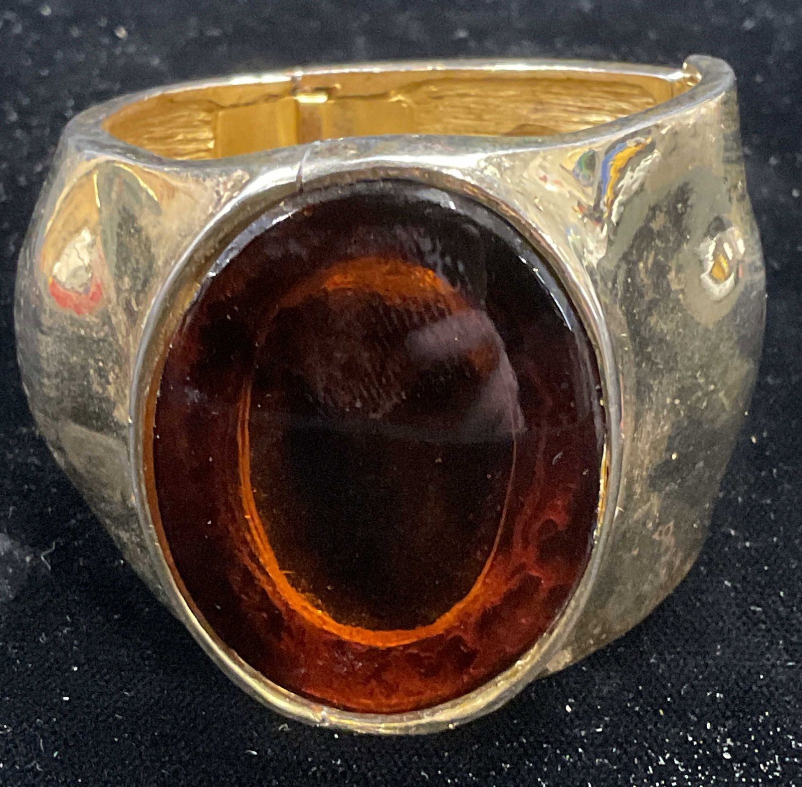 Vtg Gold Tone Modernist Faux Stone Bracelet: Vintage gold tone modernist style wide band hinged bracelet with faux amber toned stone. Measures approx 2 inches wide. Some wear including scratching observed. Inventory from Manhattan Jewelry store 