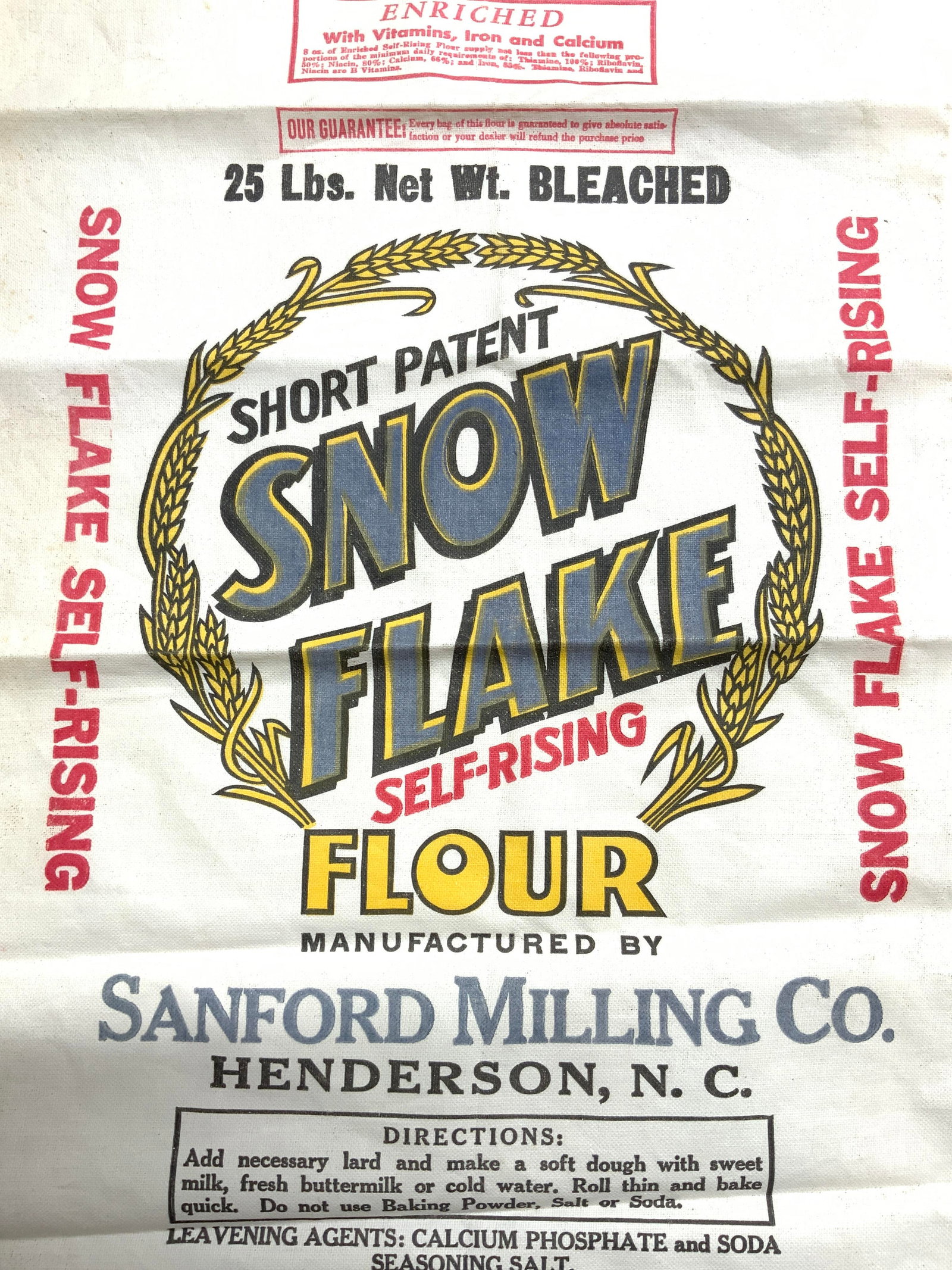 SANFORD MILLING CO Snow Flake Flour Bag: Flour bag reads SNOW FLAKE SELF RISING FLOUR MANUFACTURED BY SANFORD MILLING CO. Flour bag is vintage. Piece is cream toned. Appears to be crafted from canvas. Laying flat bag measures approximately 2