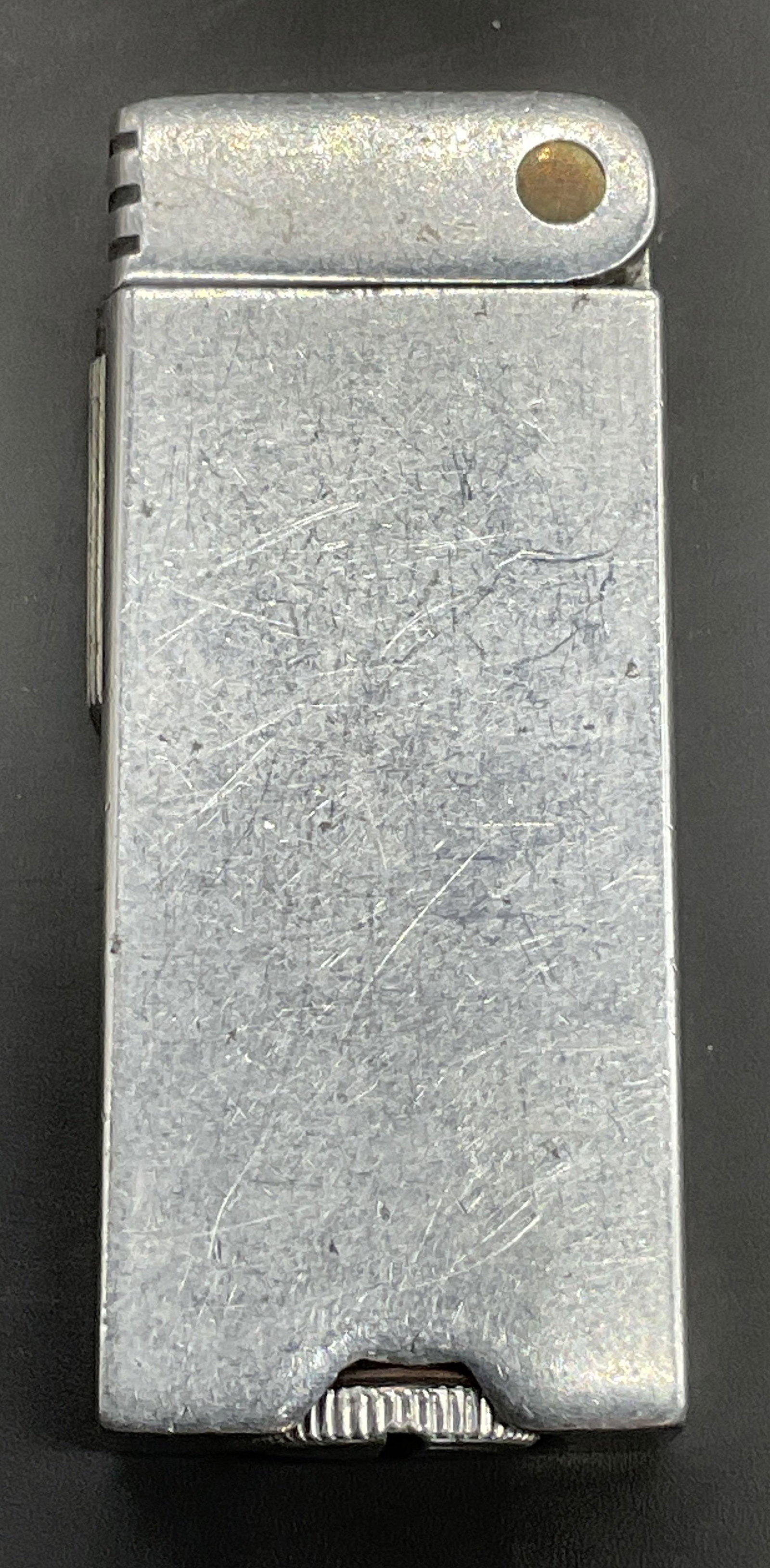 Vintage Silver Tone Metal Block Lift Arm Lighter: Vintage Silver Tone Metal Block Lift Arm Lighter. Measures approx. 2.5L x 1W in. Not tested for function. Surface wear consistent with age, use, and exposure. home decor, home accents, homewares, hous