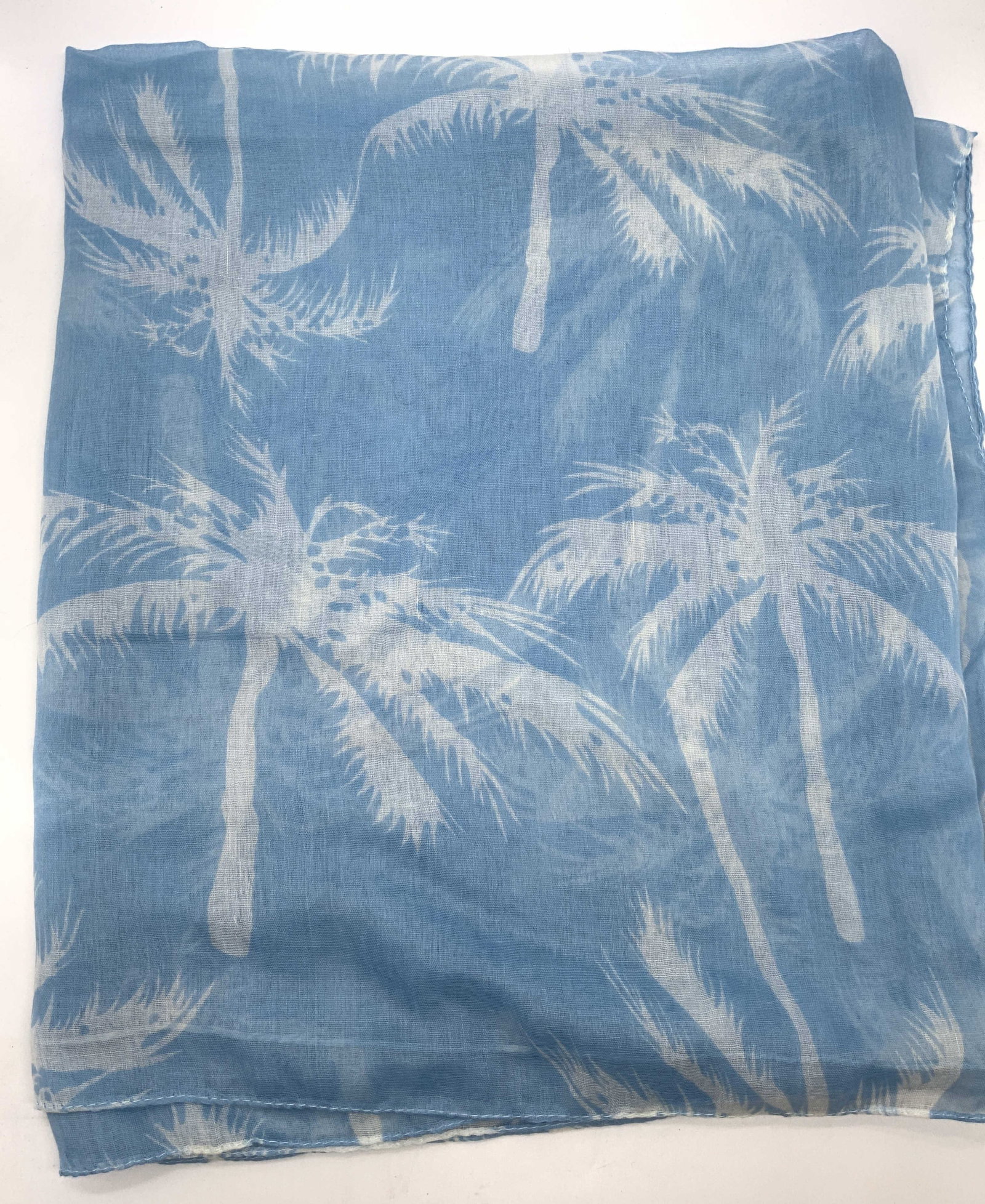 Light Blue Palm Tropical Tree Pattern Scarf: Light Blue Palm Tropical Tree Pattern Scarf Scarf that has a pattern of white palm trees. Appears to be cotton material. Surface wear consistent to age, use & exposure. Measurements: length 70in x wid