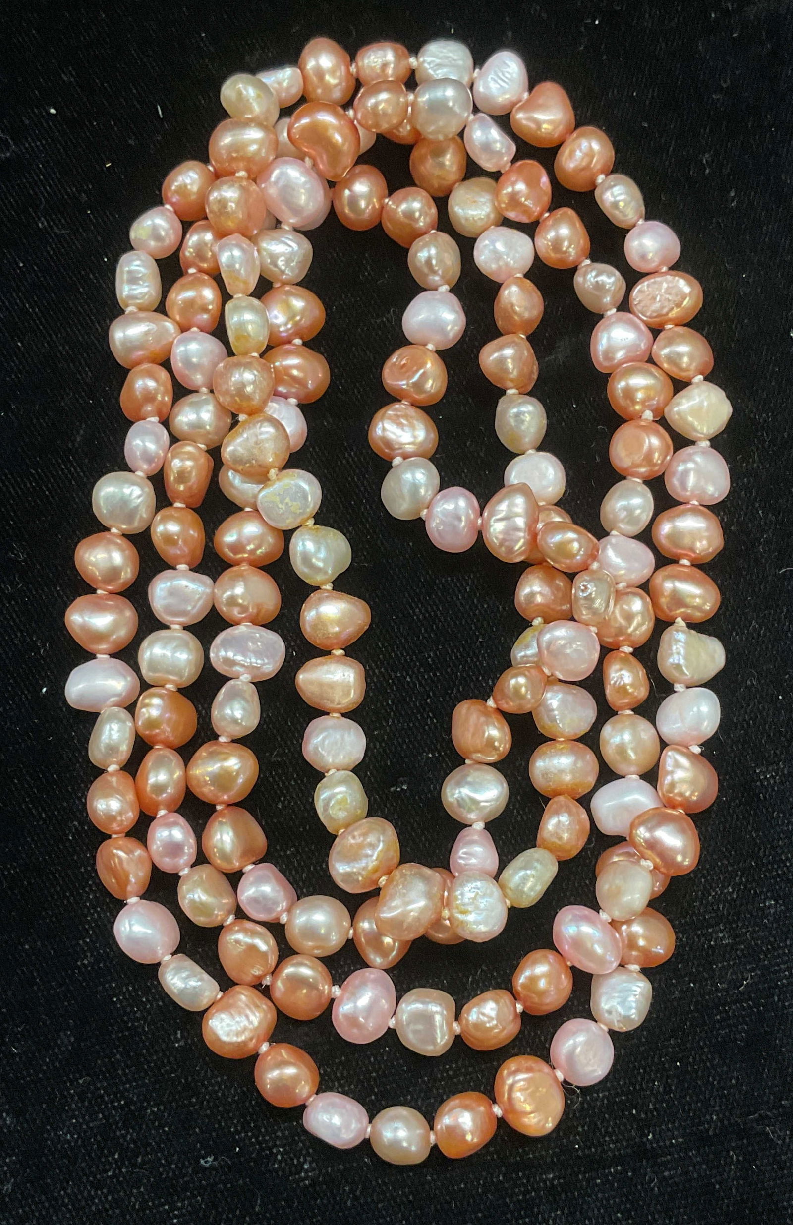 Vintage Pink Pearl Beaded Necklace: Vintage pink dyed pearl beaded necklace on double knotted string. Drop length approx 20 inches. Necklace has weight. Some wear including scratching observed. Inventory from Manhattan jewelry store cir