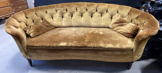 Vintage Tufted Yellow Velvet Upholstery Sofa: Vintage Tufted Yellow Velvet Upholstery Sofa / Love Seat. Deep yellow hue. Carved wooden feet to the piece. Comes with two throw pillows. Measures approx. 28H x 80W x 23D in. Depth measured at the sea