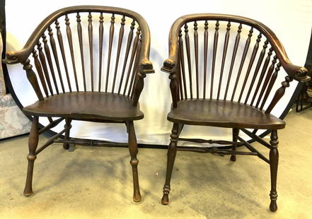 Lot 2 19th C Windsor Style Chairs W Dolphin Arms: Lot includes 2 Windsor style chairs. Each are wooden with spindle backrests. Each dolphin head carvings at ends of armrests. Chairs appear to be antique circa 19th Century. Chairs each have box stretc