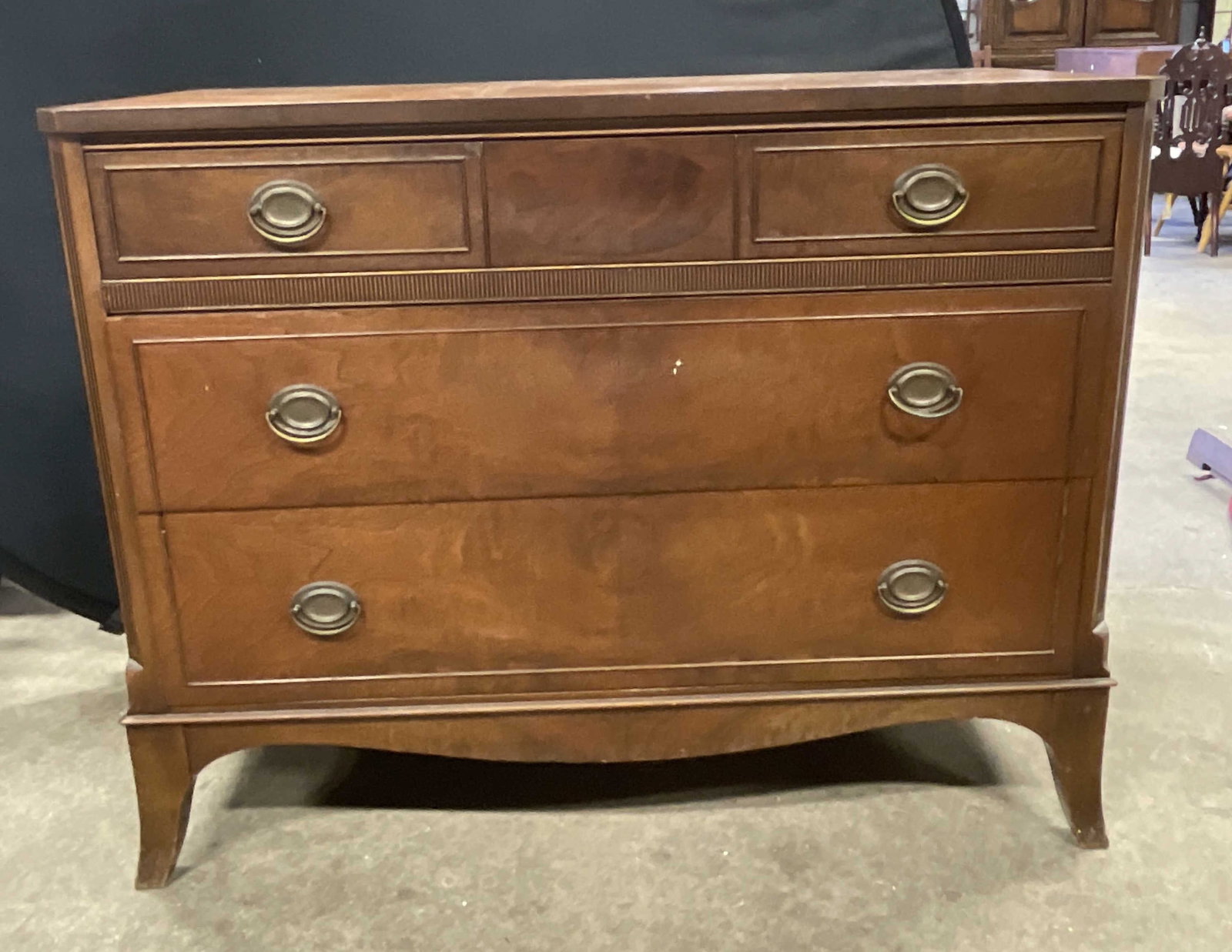 Vintage Walnut Veneer & Gum Wood Chest of Drawers: Vintage Walnut Veneer & Gum Wood Chest of Drawers. Three drawers with metal drawer pulls. Dovetailing to the drawers. Slight splay to the legs. Measures approx. 45W x 21D x 35H in. Partial tag to reve