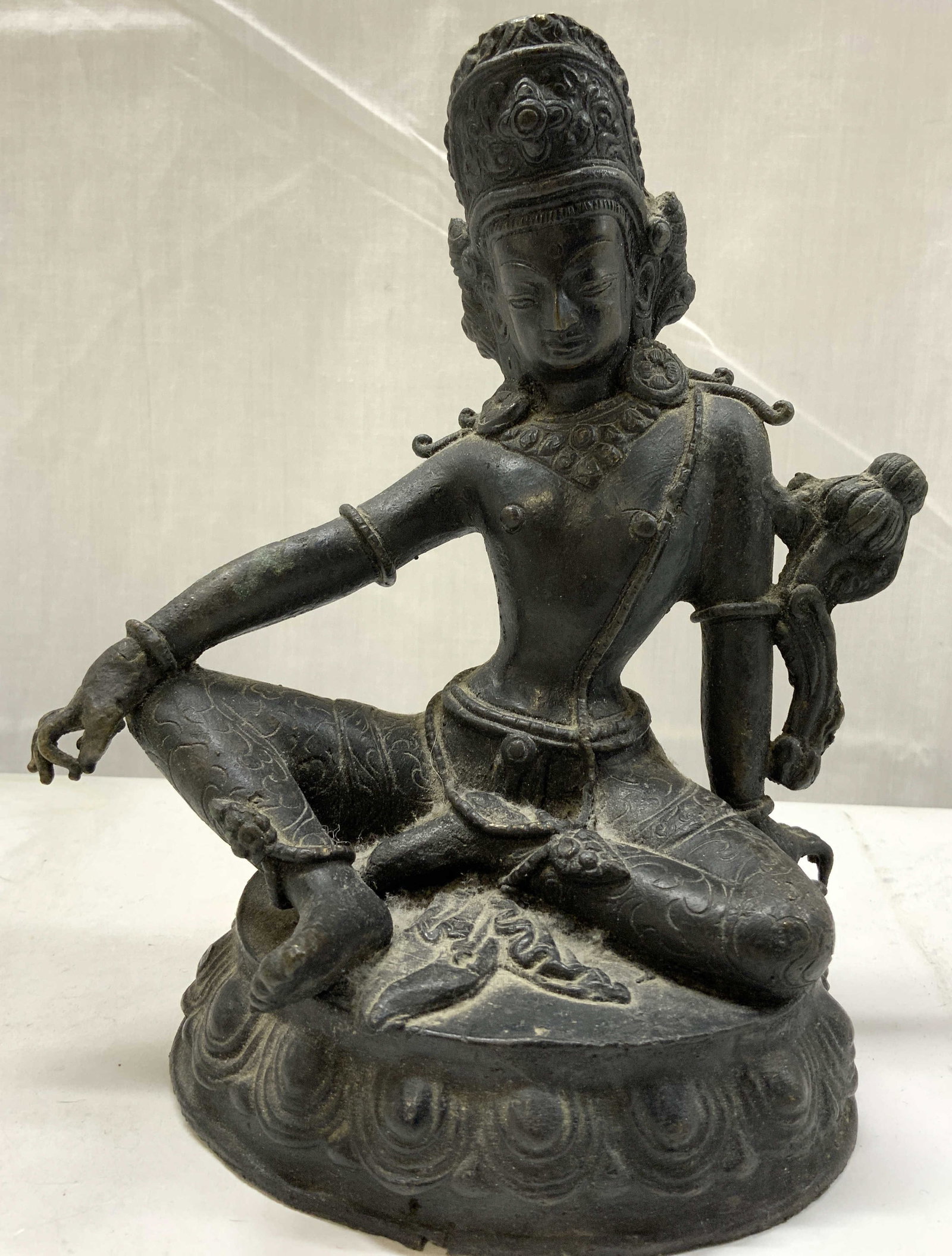 Avalokiteshvara Buddhist Cast Metal Figurine: Avalokiteshvara Buddhist Cast Metal Figurine Figurine is in a seated position & has detailed texture. Material appears to be cast metal. Surface wear consistent to age, use & exposure. Measurements: l