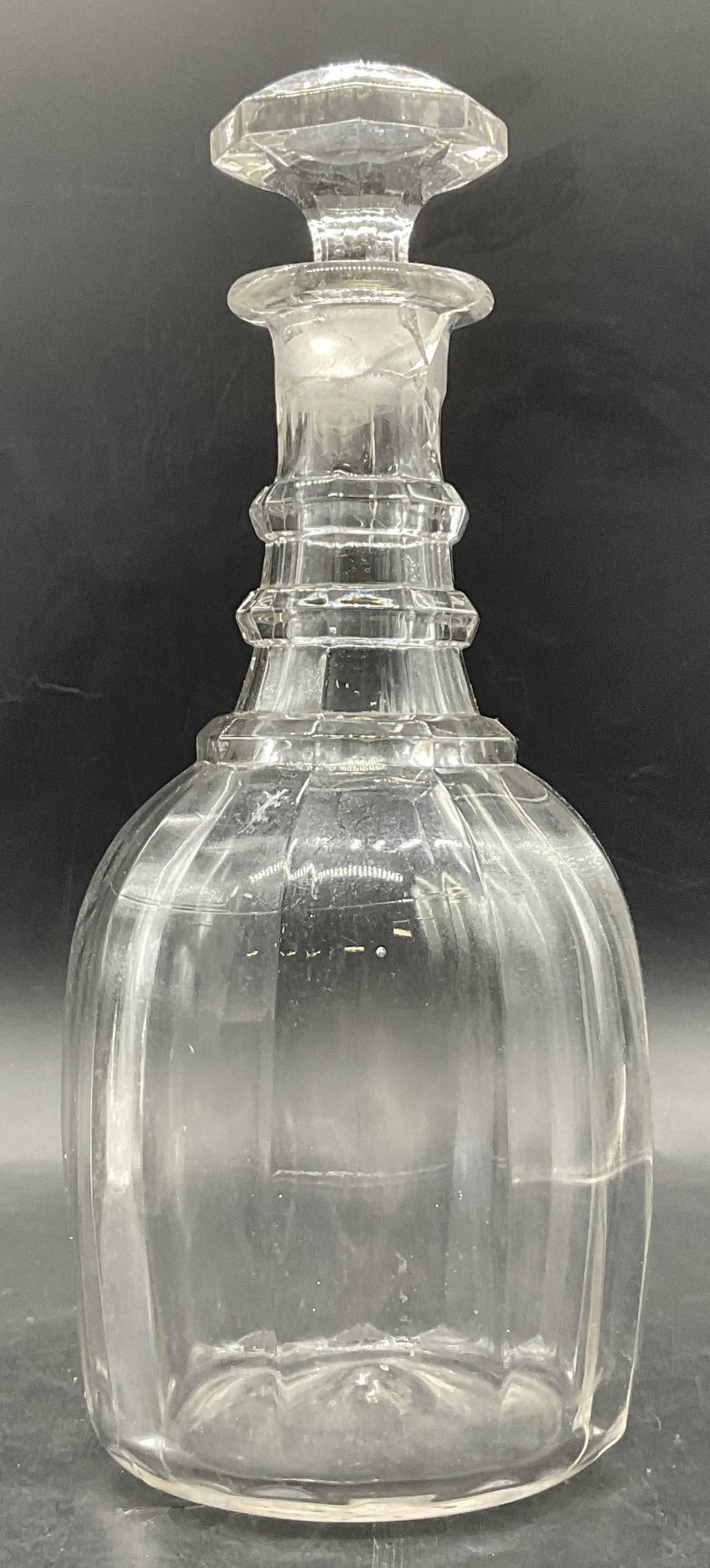 Vintage Art Glass Decanter W/ Stopper: Vintage Art Glass Decanter With Stopper. Ribbed design. Measures approx. 11H x 4W in. Pontil to underside. Bubbles to the glass. Chipping, cracking, discoloration, and surface wear present. home decor