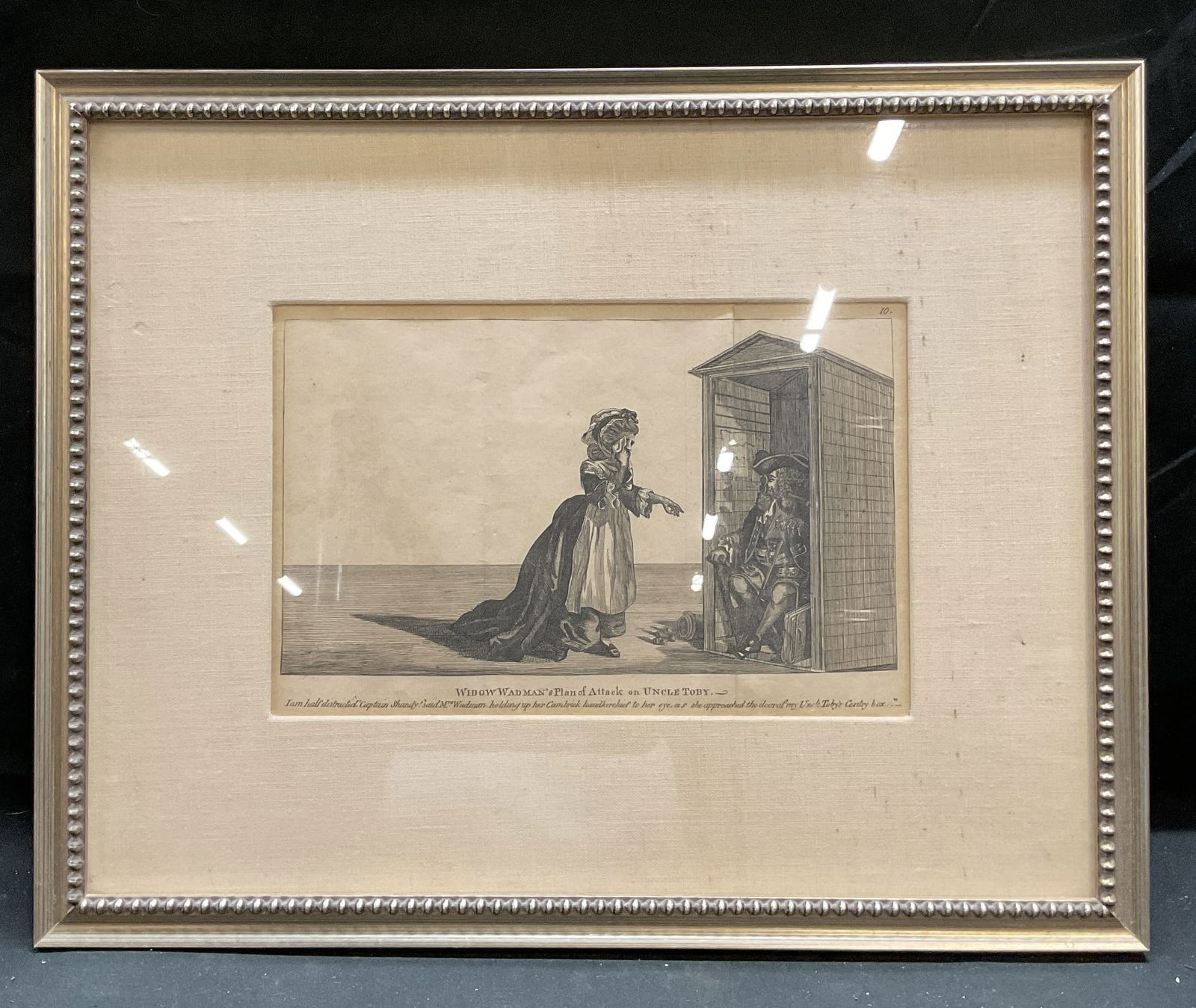 Framed Antique Widow Wadman Uncle Toby Engraving: Antique framed and matted engraving. Widow Wadmans Plan of Attack in Uncle Toby. From The life and opinions of Tristram Shandy by Laurence Stern. Silver leaf wood frame. Not examined out of frame. Fra