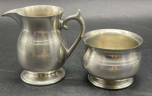 WOODBURY PEWTERERS Pewter Sugar Bowl & Creamer: WOODBURY PEWTERERS Vintage Pewter Sugar Bowl & Creamer. The creamer measures approx. 4.25W x 4H in. Measured at widest point. Undersides are signed. Surface wear consistent with age, use, and exposure