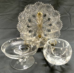 Lot 3 Assorted Gls & Crystal Tabletop: Lot include 1 crystal votive, 1 glass pedestaled dish & 1 crystal toothed rim dish with intricate geometric relief detail. Toothed dish measures approximately 7.25 inches wide. Glass tabletop, crystal