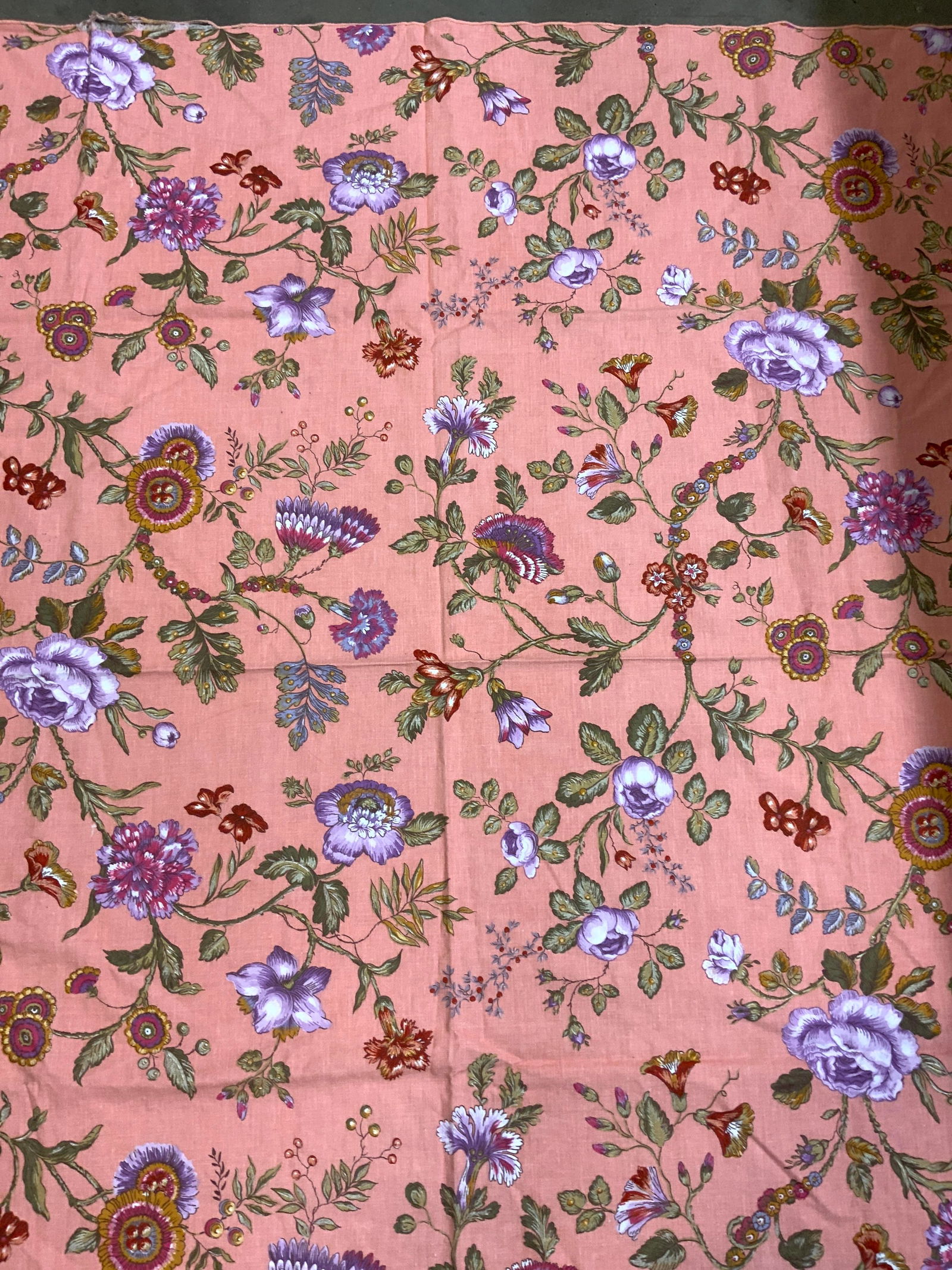Pink Floral & Botanical Print Tablecloth: Pink Floral & Botanical Print Tablecloth Rectangular tablecloth that has a pink background & a floral & botanical pattern. Tablecloth has shades of purple, pink, yellow, green & more. Surface wear con