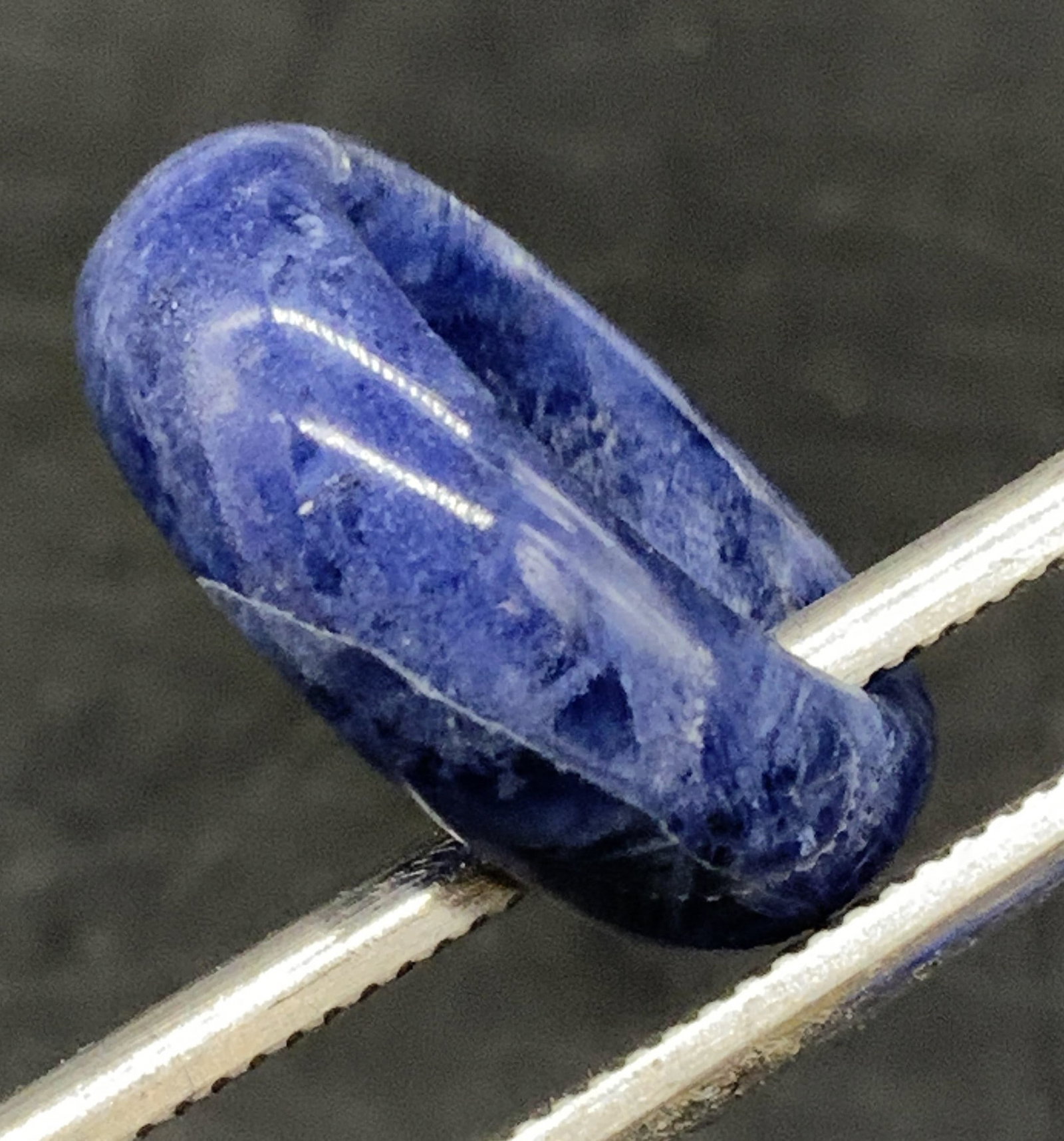 Vintage Polished Sodalite Ring: Vintage Polished Sodalite Ring. Primarily blue with white hued veining throughout. Ring size approx. 7. Imperfections to the stone. Surface wear consistent with age, use, and exposure. Vintage jewelry