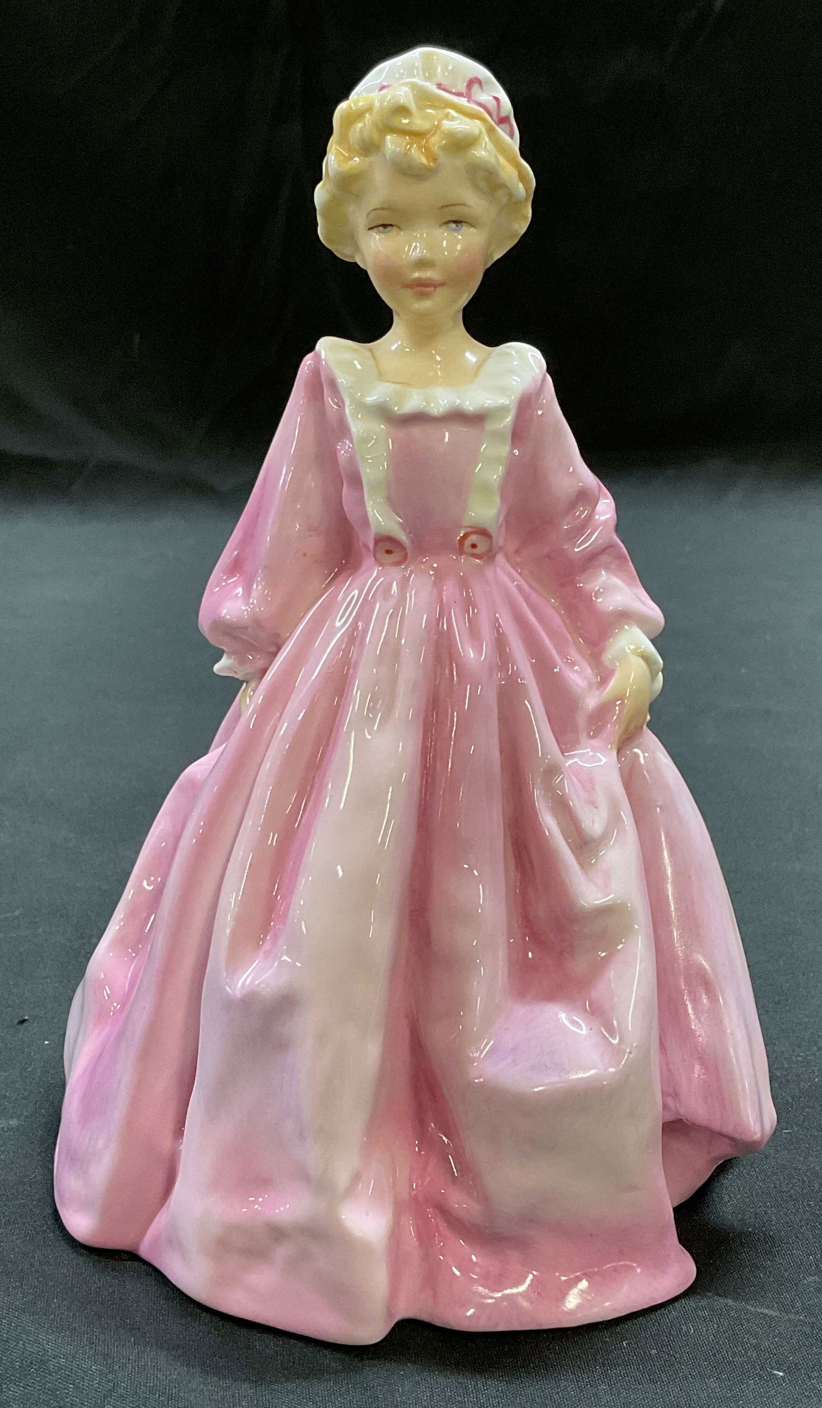 Royal Worcester Grandmothers Dress Figurine ENG: Royal Worcester fine bone china figurine. Grandmothers Dress. Modeled by F. G. Doughty. Signed. Made in England. Hand painted. Measures approx 4.5 x 4.5 x 6.5 inches. Some wear consistent with exposur