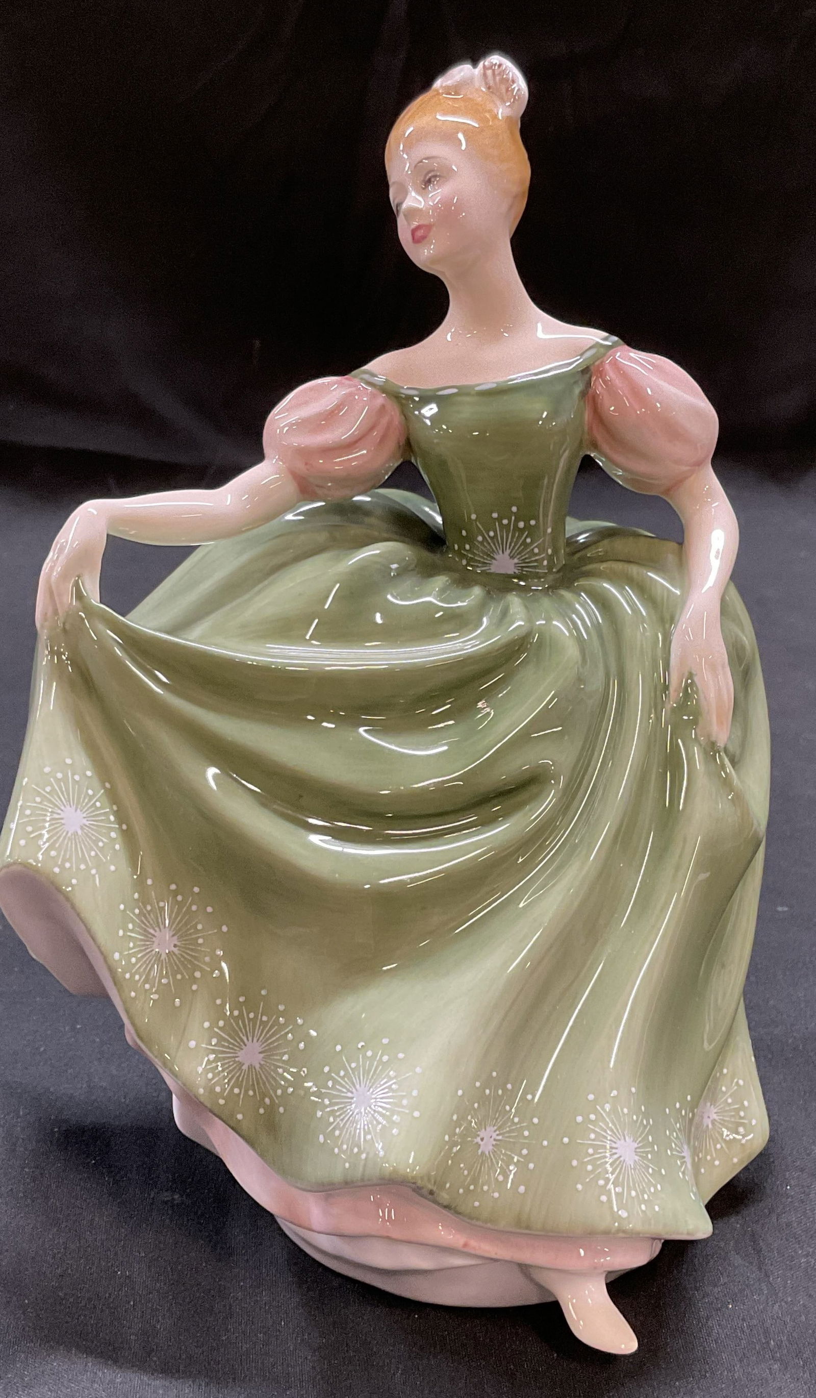 Royal Worcester Michele Bone China Figurine: Royal Worcester fine bone china figurine. Michele. Woman in green dress. Hand painted. Signed. Made in England. Measures approx 4.75 x 4.5 x 7 inches. Royal Worcester, Royal Worcester figurine, Michel
