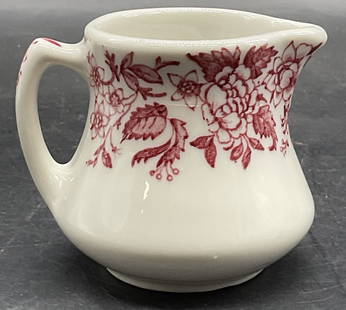 JACKSON CHINA Vntg Transferware Creamer PA USA: JACKSON CHINA Vintage Red Transferware Ceramic Creamer. Red floral and foliage motif to the piece. Underside signed JACKSON CHINA FALLS CREEK PA V6. Measures approx. 2.5H x 3W in. Measured at widest p