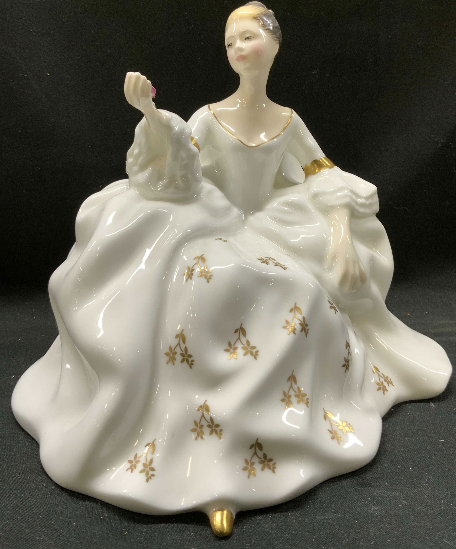 ROYAL DOULTON My Love BONECHINA Figurine ENGLAND: ROYAL DOULTON My Love BONECHINA Figurine ENGLAND Bone china figurine depicting a lady in a white & gold dress. Lady is holding a rose. Signed & marked on underside. Reads ROYAL DOULTON. Surface wear c