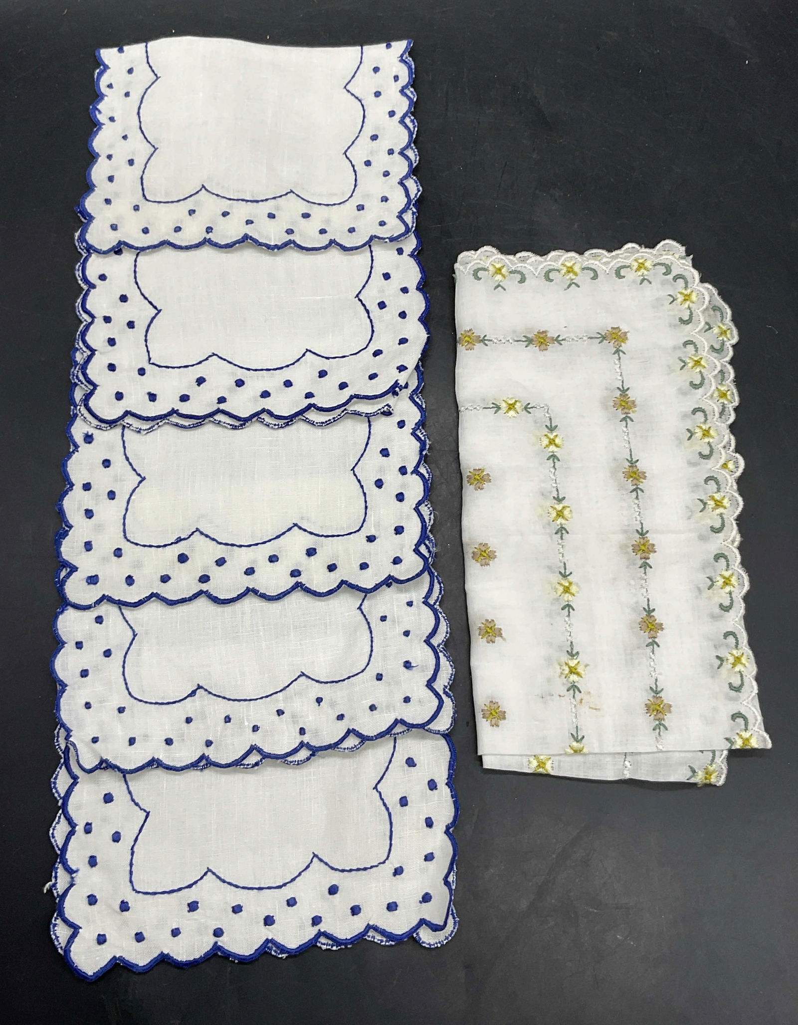Lot 6 Vintage Embroidered Hankies + Napkins: Lot of Six Vintage Embroidered Handkerchiefs. Decorated with florals or dots. Blue and white fabric cocktail napkins measure approx. 8W x 5L in. The handkerchief features embroidered yellow and green