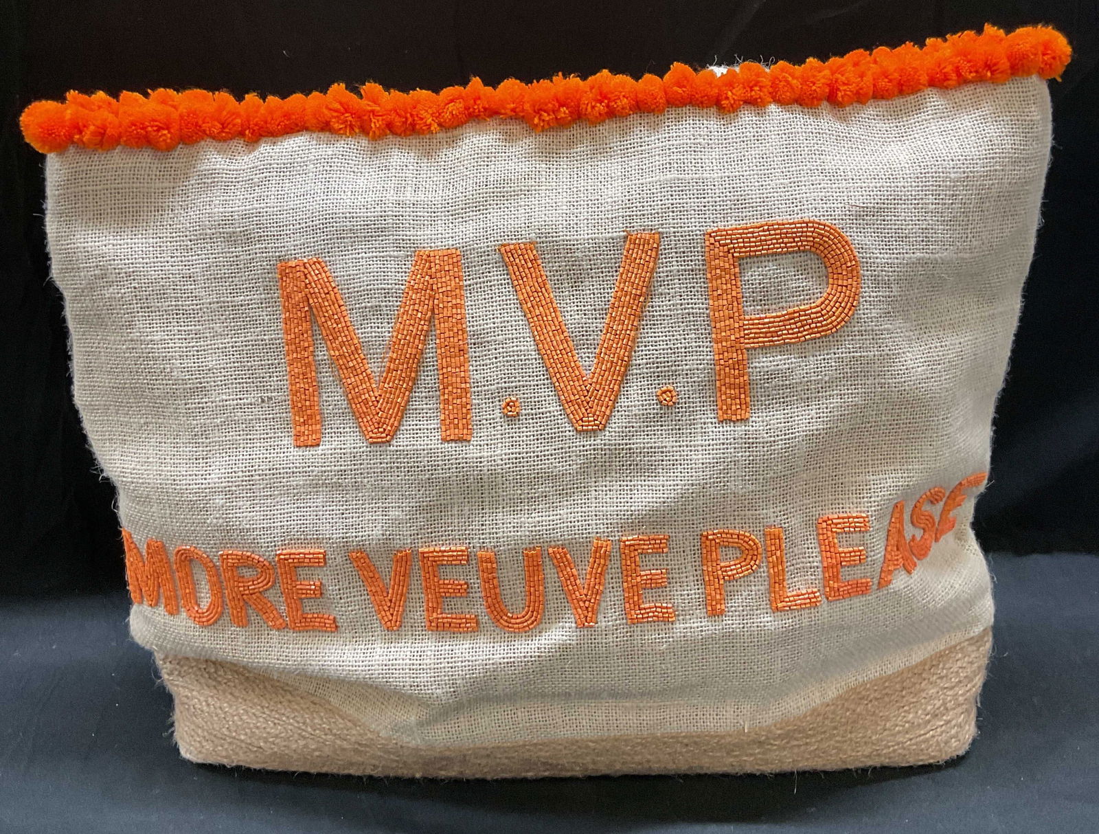 Tiana More Veuve Please Beaded Canvas Tote: Tiana canvas tote handbag. Orange beaded decoration. Reads MVP More Veuve Please. Signed Tiana on label. Satin lined interior with pockets. Measures approx 16 x 4 x 14 inches. Some wear to material co