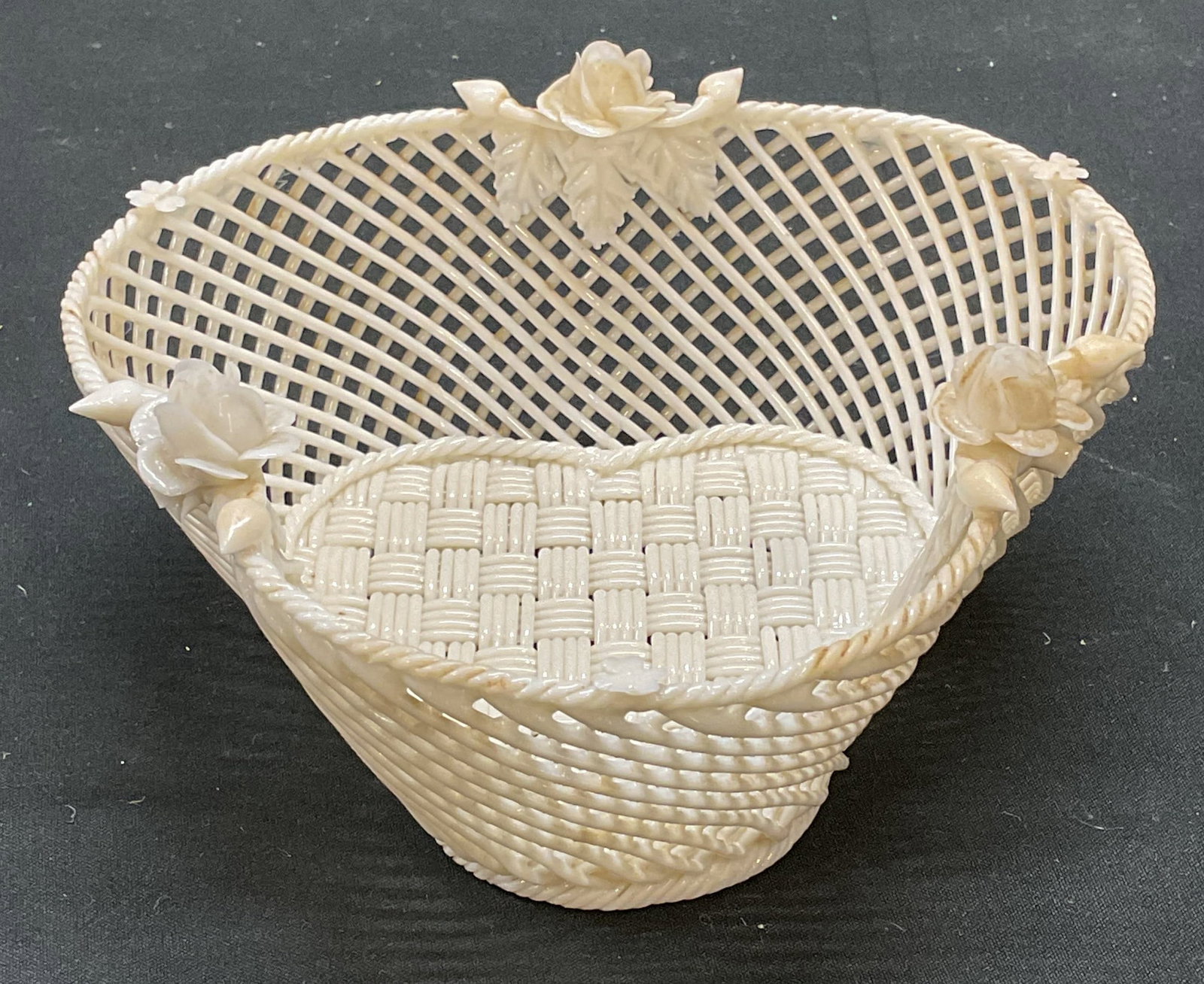 Vintage BELLEEK Ireland Floral Porcelain Basket: Vintage BELLEEK floral porcelain basket in white. Woven design. Measures approx 5.25 x 5 x 2 inches. Signed. Made in Ireland. Some wear consistent with exposure. Basket, porcelain basket, woven basket