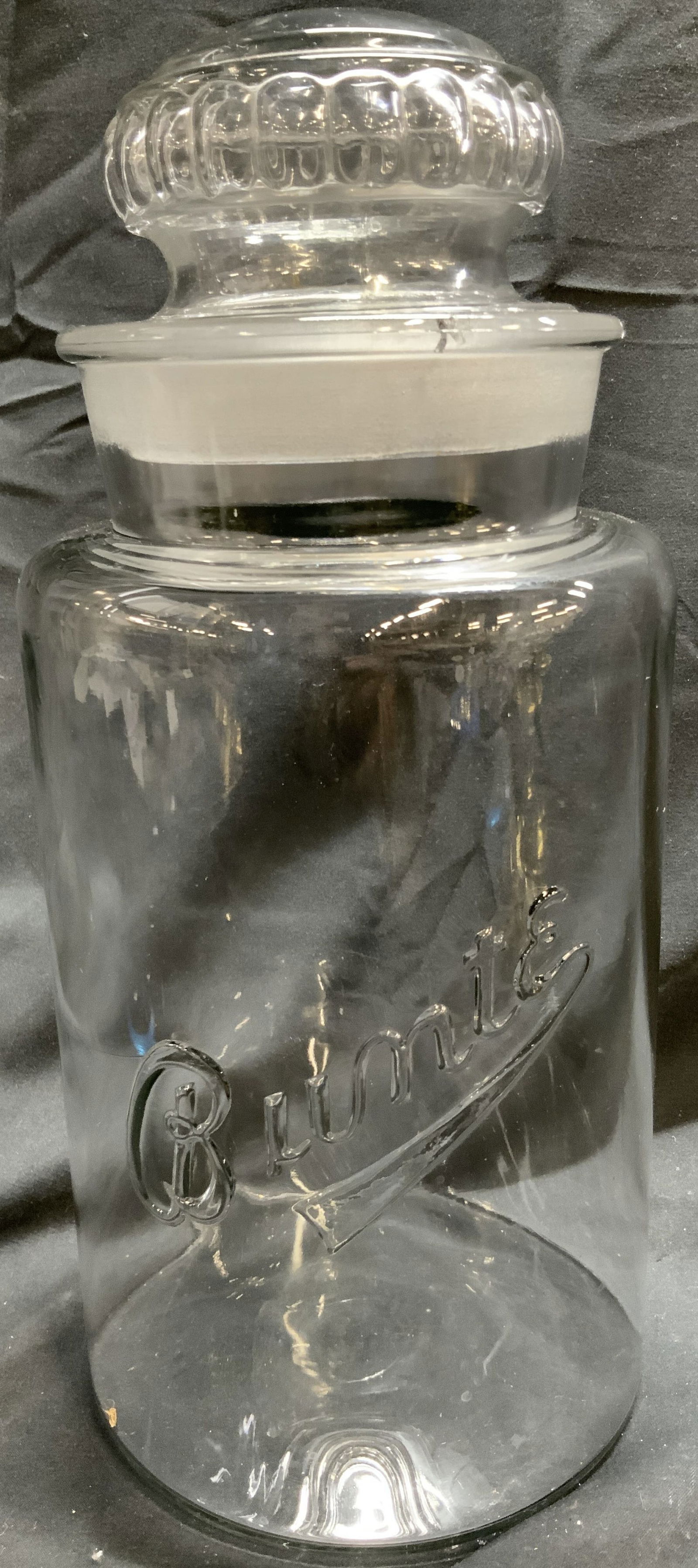 BUNTE Art Glass Jar Vessel w Lid: Jar has beveled lettering which reads BUNTE. Piece is crafted from glass. Jar includes lid. Inner rim and base of lid has frosted areas. Jar with lid measures approximately 12 inches tall 5 inches wid