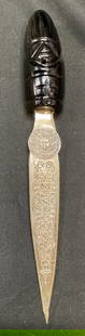 Alpaca Aztec Motif Letter Opener, Mexico: Alpaca Aztec motif letter opener. Silver tone blade and faux iridescent stone handle. Signed. Measures approx 7.5 inches long. Alpaca letter opener, Aztec style letter opener, letter opener, faux ston
