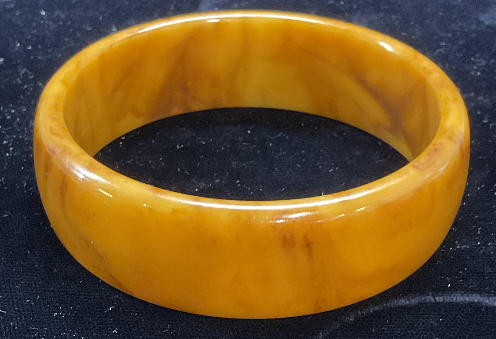 Faux Amber Acrylic Bangle Bracelet: Faux Amber acrylic bangle bracelet. Measures approx 2.5 inches wide. Some wear including scratching observed. Jewelry, estate jewelry, costume jewelry, cocktail jewelry, fashion jewelry, accessories, 