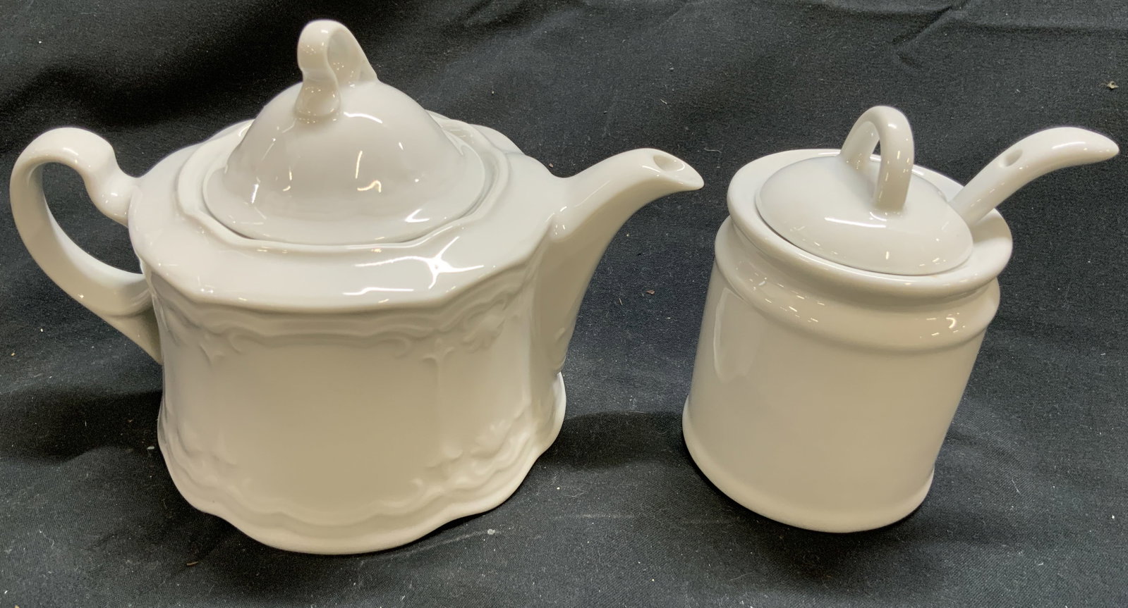 SELTMANN WEIDEN Porc Teapot & Sugar Dishes W Lids: Underside of teapot is marked SELTMANN WEIDEN. Each piece is white toned and porcelain. Vessels each include lids. Lot includes 1 teapot & 1 sugar dish with lid and spoon. Teapot measures approx 6.25 