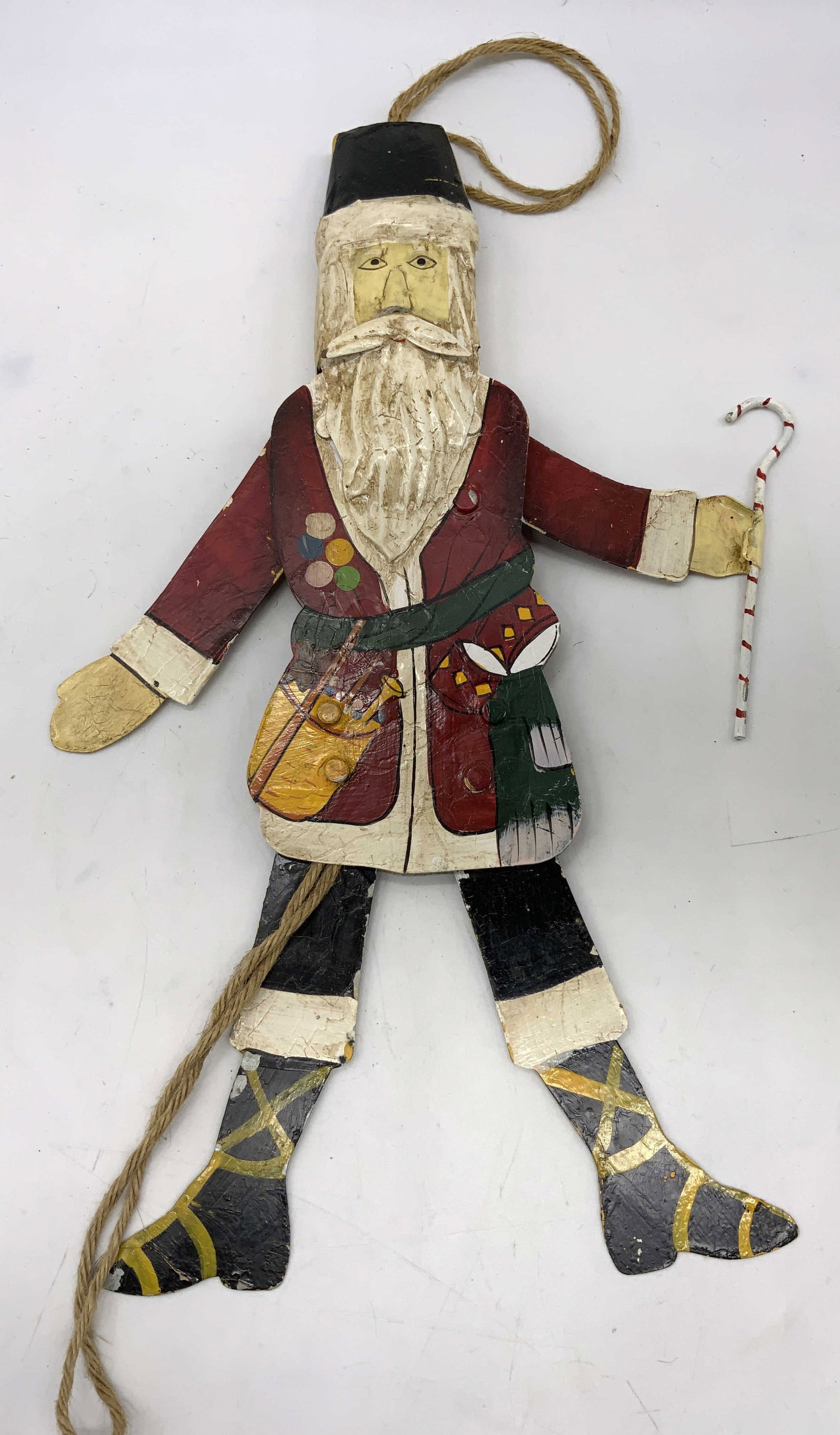 Santa Claus Articulated Metal Christmas Wall Decor: Santa Claus Articulated Metal Christmas Wall Decor Figure depicting an articulated Santa Claus. Figure has a string coming out of black hat. Surface wear consistent to age, use & exposure. Measurement
