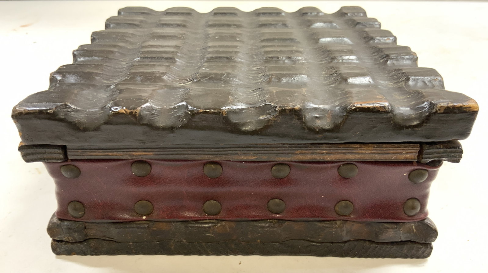 Vtg Wooden Medieval Style Keepsake Box W Lid: Keepsake box is vintage. Piece appears to be wooden & lined with wine red toned leather. Box is medieval style with uniquely carved pattern on lid. Box measures approximately 7 inches square 3 inches 