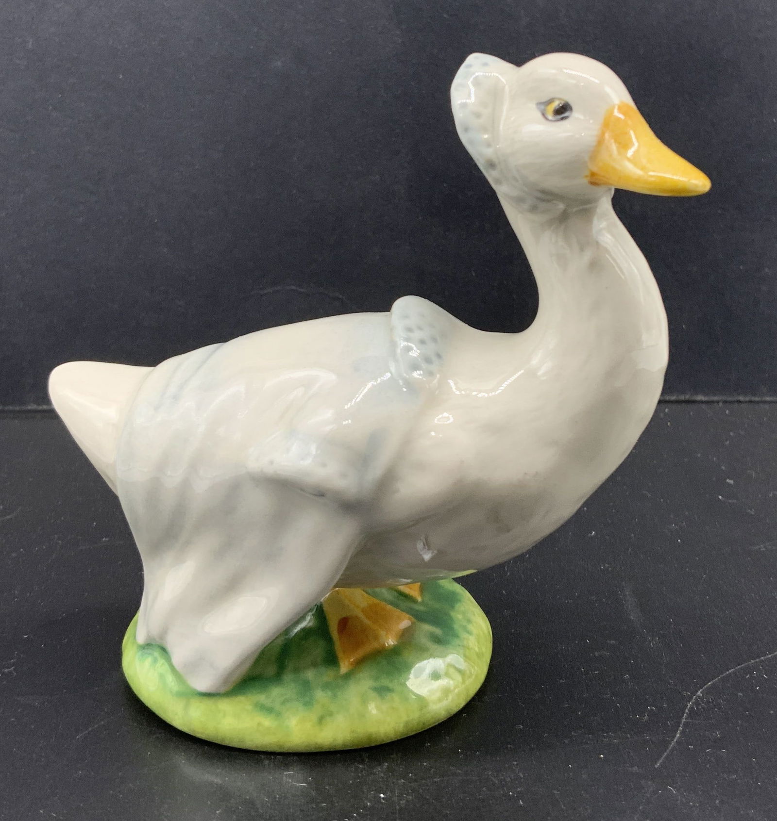 Beatrix Potter Rebecca Puddle-Duck Figural ENGLAND: Beatrix Potter Rebecca Puddle-Duck Figural ENGLAND Figural depicting a duck wearing a blue bonnet. Underside reads REBECCAH PUDDLE-DUCK F.WARNE&CO. 1981. Surface wear consistent to age, use & exposure