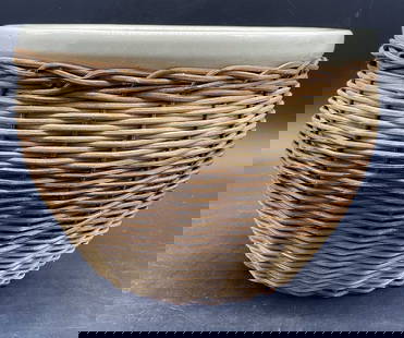 Vintage Woven Wicker Encased Ceramic Planter: Vintage Woven Wicker Encased Ceramic Planter. Measures approx. 6.75H x 9W in. Pitting, losses to wicker, surface wear, and discoloration present. Jardiniere, garden accents, garden accessories, garden