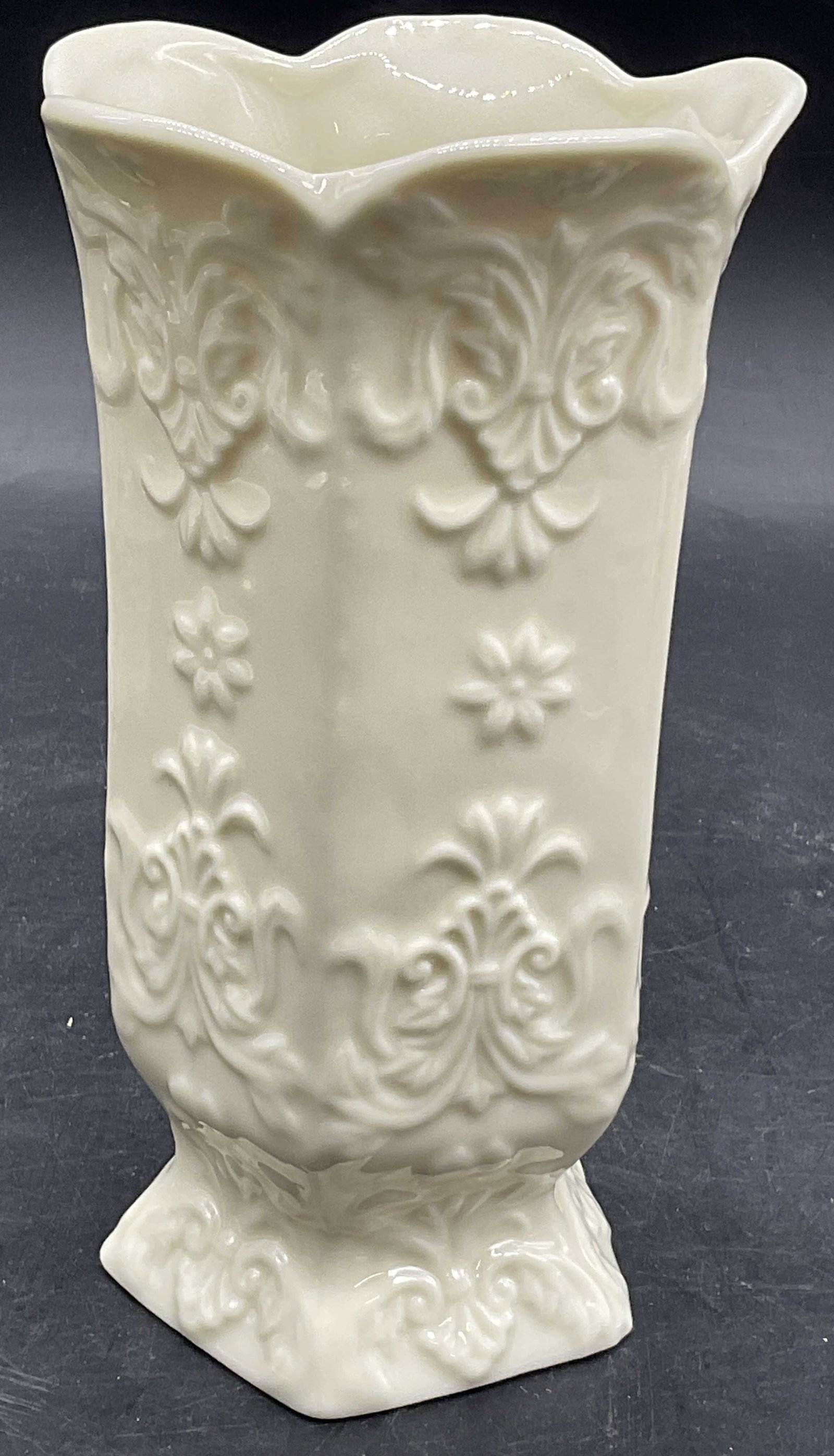 Vintage Embossed Porcelain Scalloped Rim Vase: Vintage Embossed Porcelain Scalloped Rim Vase. Cream hued finish to the porcelain. Measures approx. 6H x 3.25W in. Discoloration, residue, pitting, and surface wear present. home decor, home accents, 
