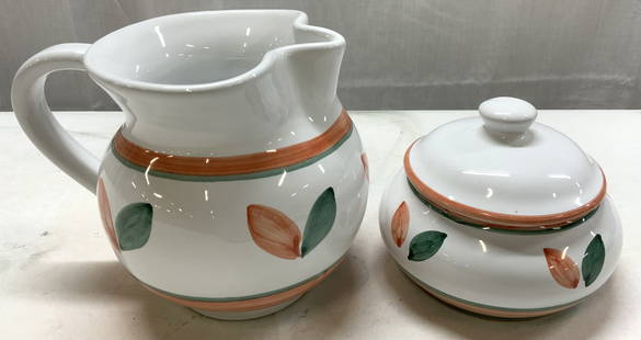 CALECA Orange & Green Pitcher & Sugar Bowl ITALY: CALECA Orange & Green Pitcher & Sugar Bowl ITALY Hand-painted pitcher & sugar bowl. Pieces have an orange & green leaf design with horizontal stripes. Signed & marked on underside. READS CALECA. ITALY